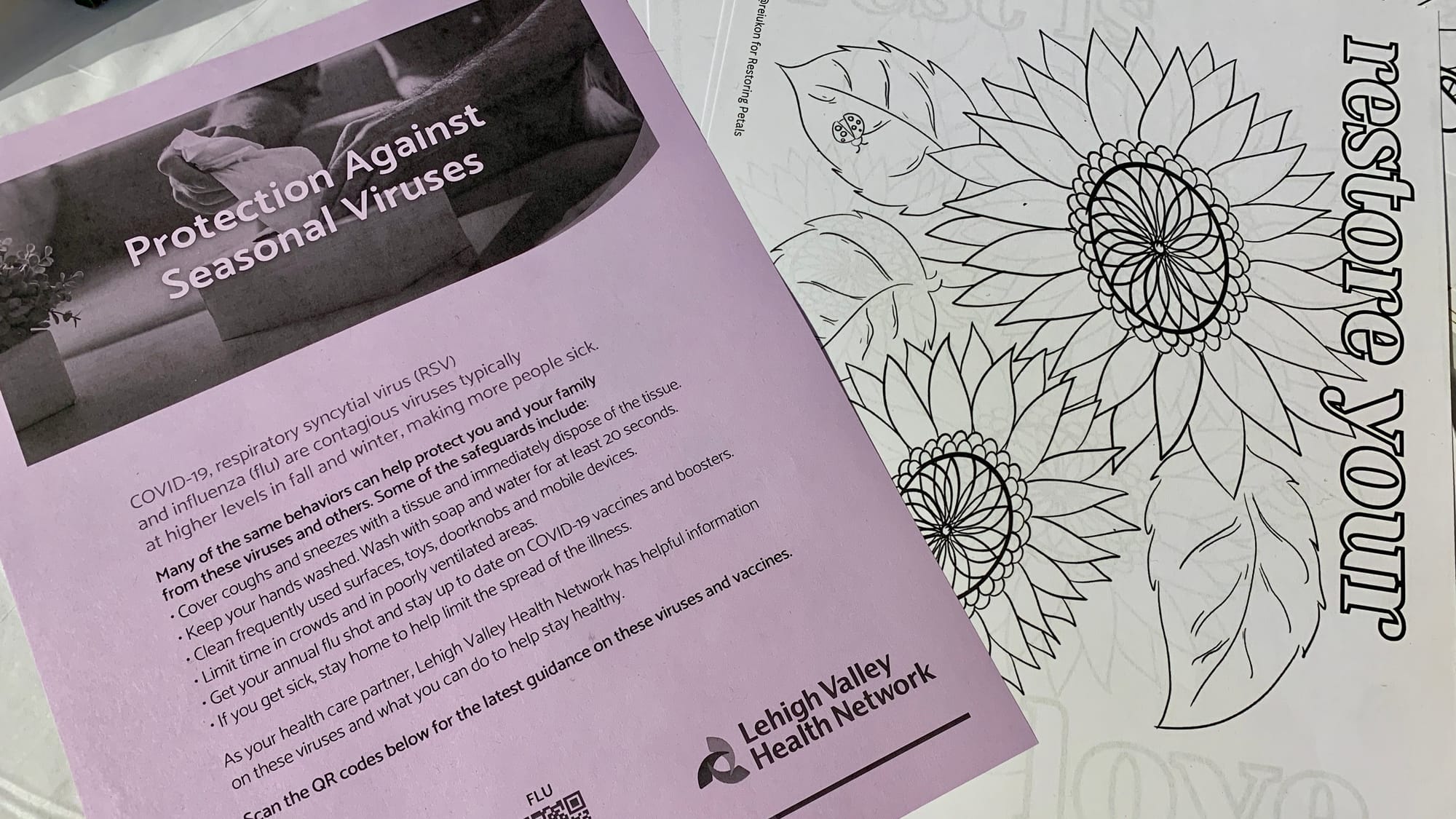 The tables at the 'Restoring Petals' exhibition also had information about how to protect from viruses.