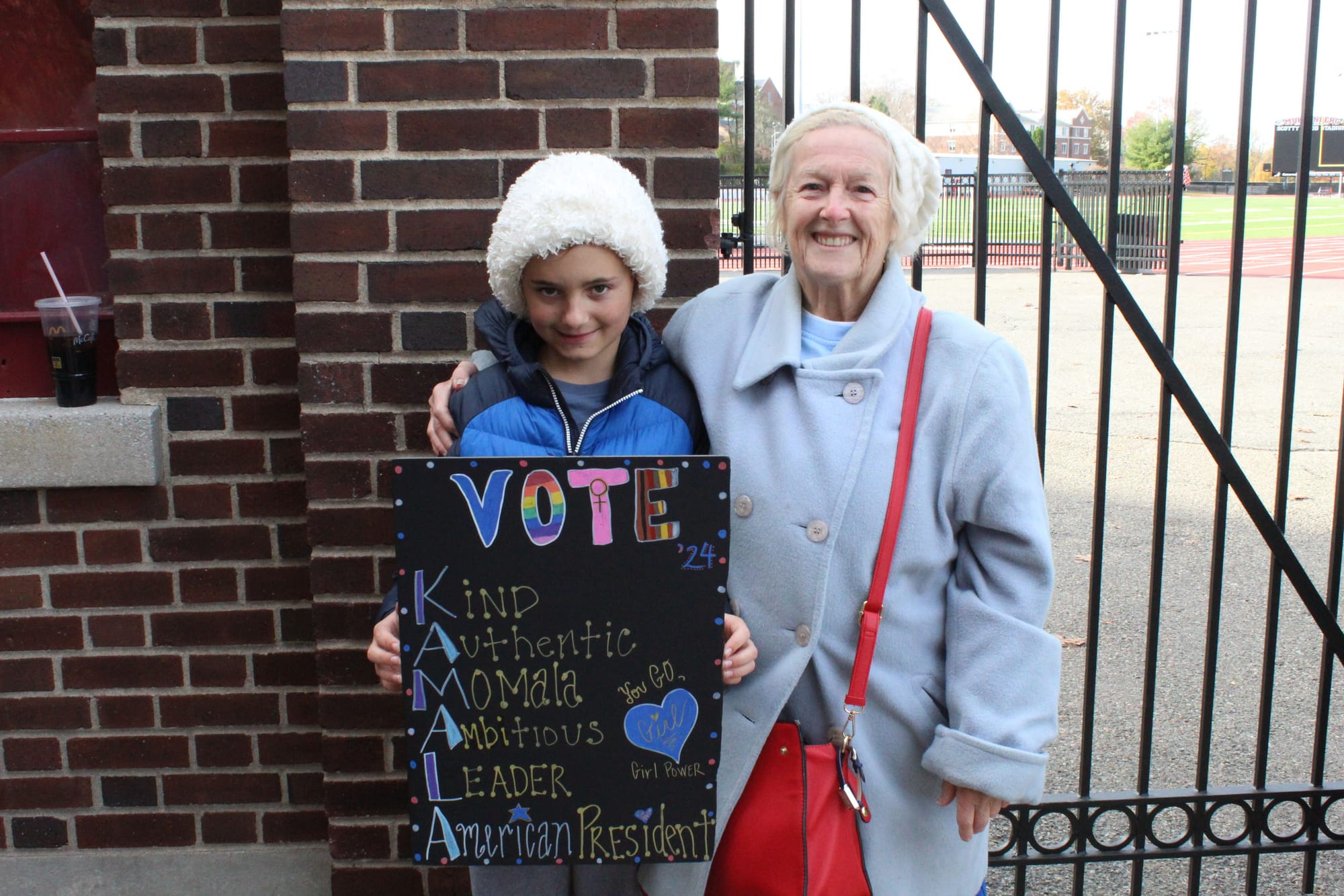 Allentown resident Elizabeth Slaby (right), with her grandson, was the first person in line for the Kamala Harris rally at Mu