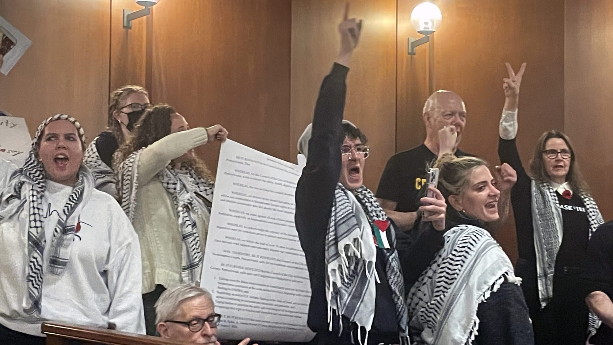Pro-Palestine activists wrote up their own cease-fire resolution, displaying it at Bethlehem Town Hall in the early morning h