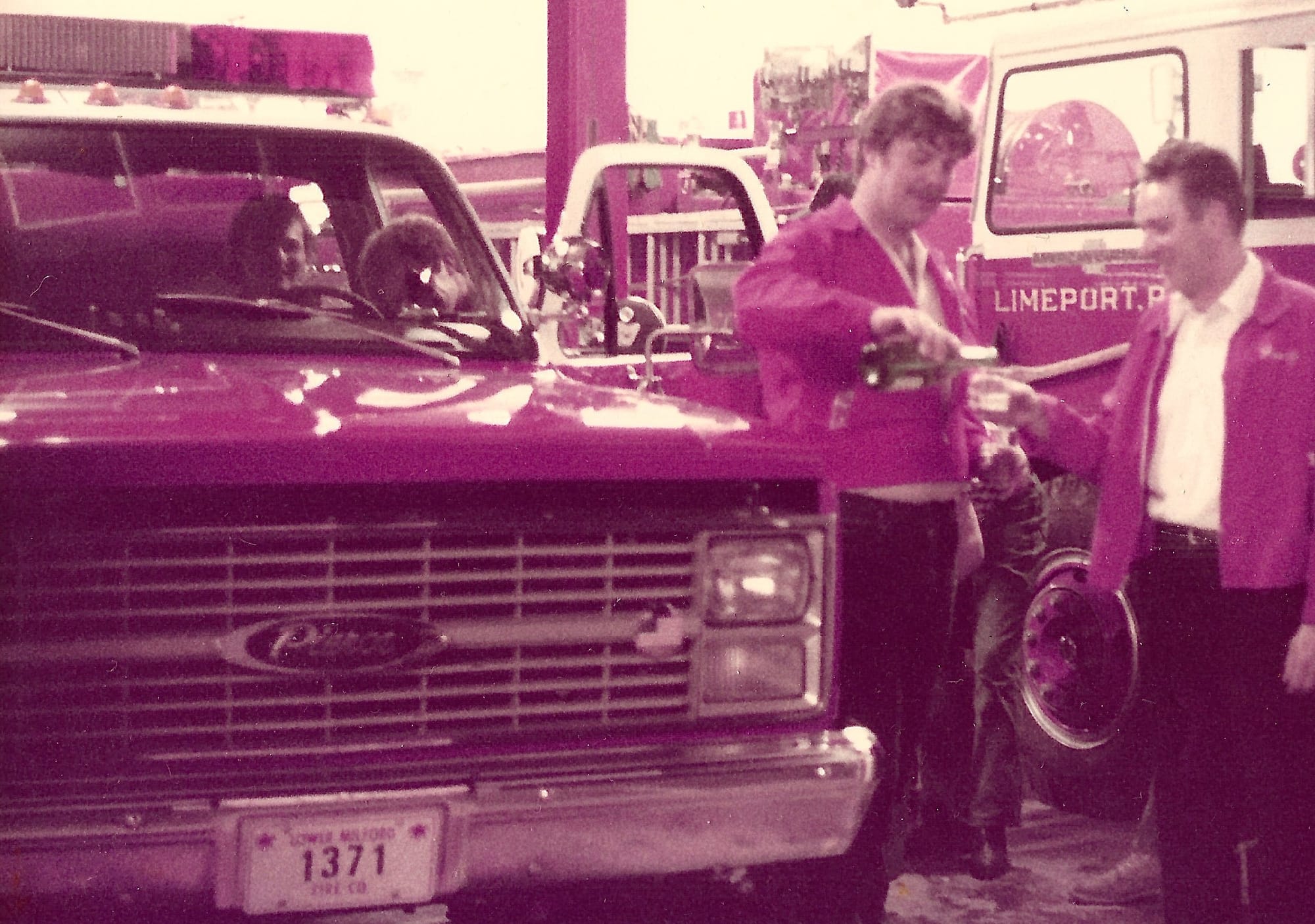 Dean Bruch (l) and Henry Iobst enjoy a champagne toast to celebrate the arrival of the new Pierce attack/mini-pumper in the e