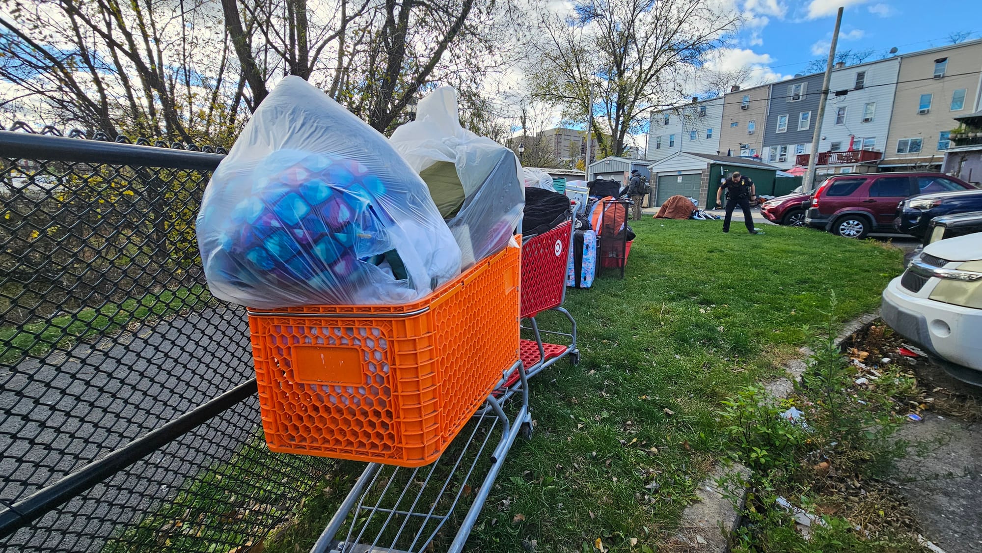 One person living at the Jordan Creek Greenway camp lined up her belongings in shopping carts as crews worked to clear the en