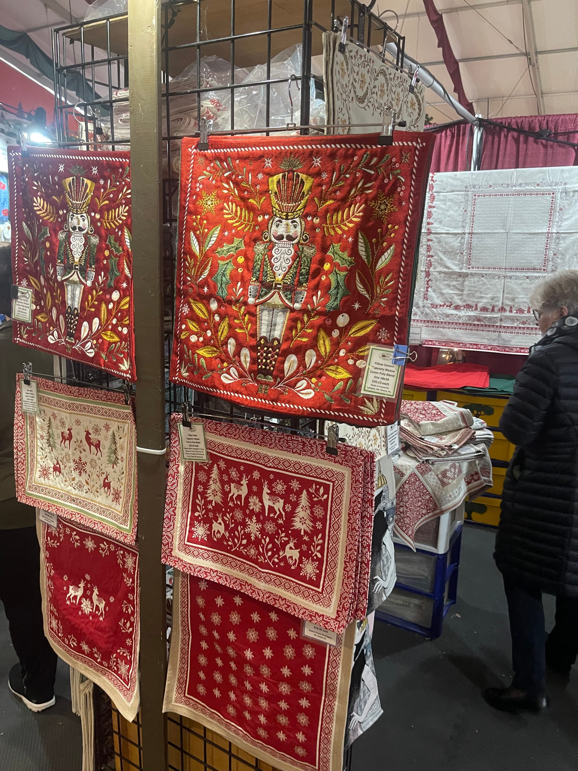 Handmade Christmas placements imported from France are available at Lacigale , a vendor that sells linens, and solemate socks
