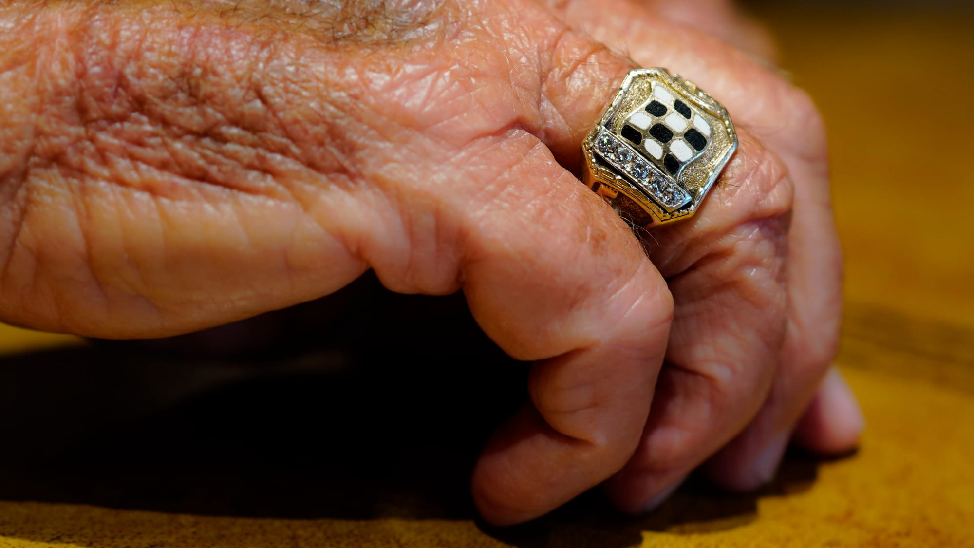 Race driver Mario Andretti wears the ring from his 1981 Indianapolis 500 win while speaking during an interview at his home i