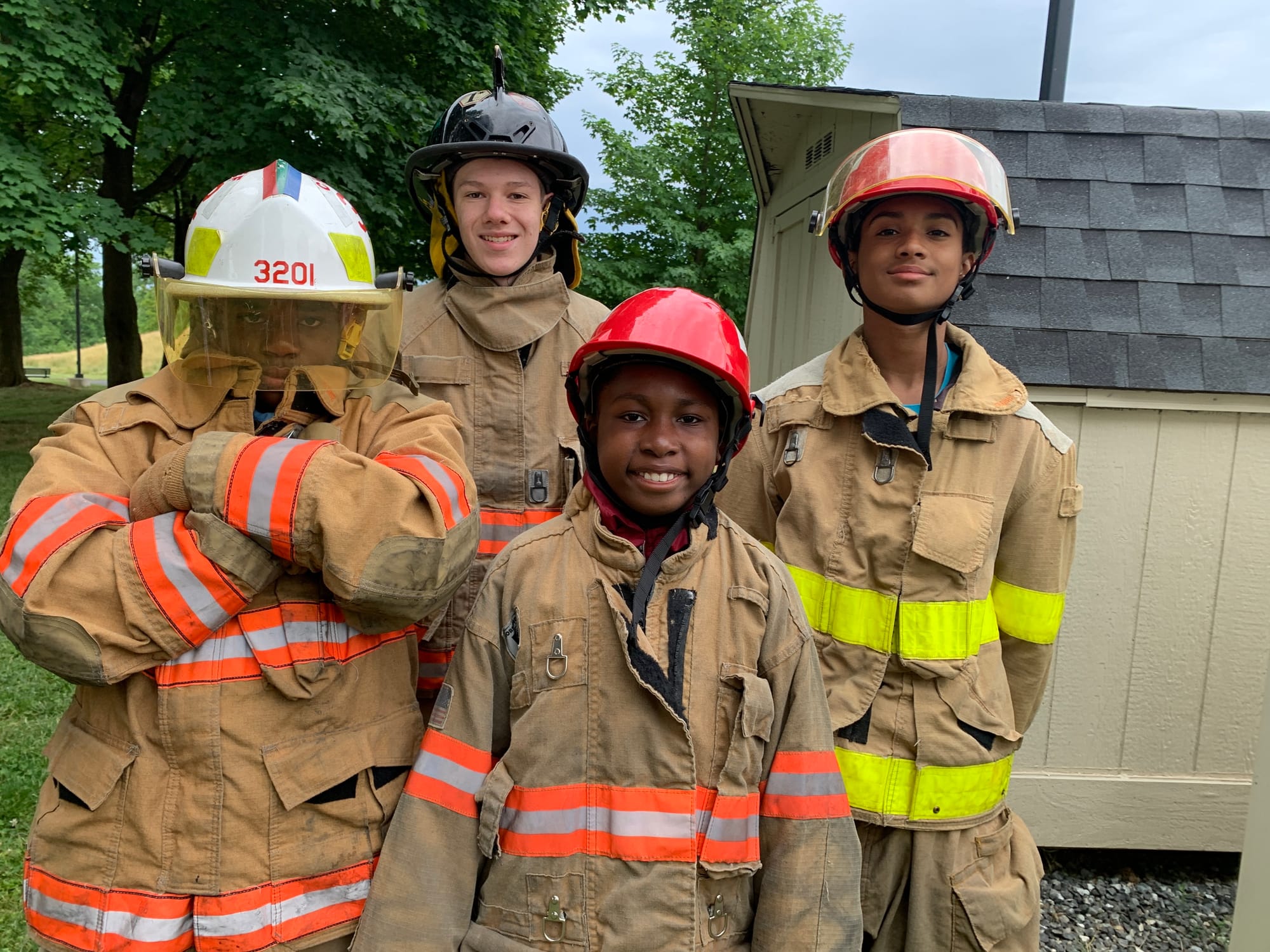 Camp attendees pose in their firefighting gear.