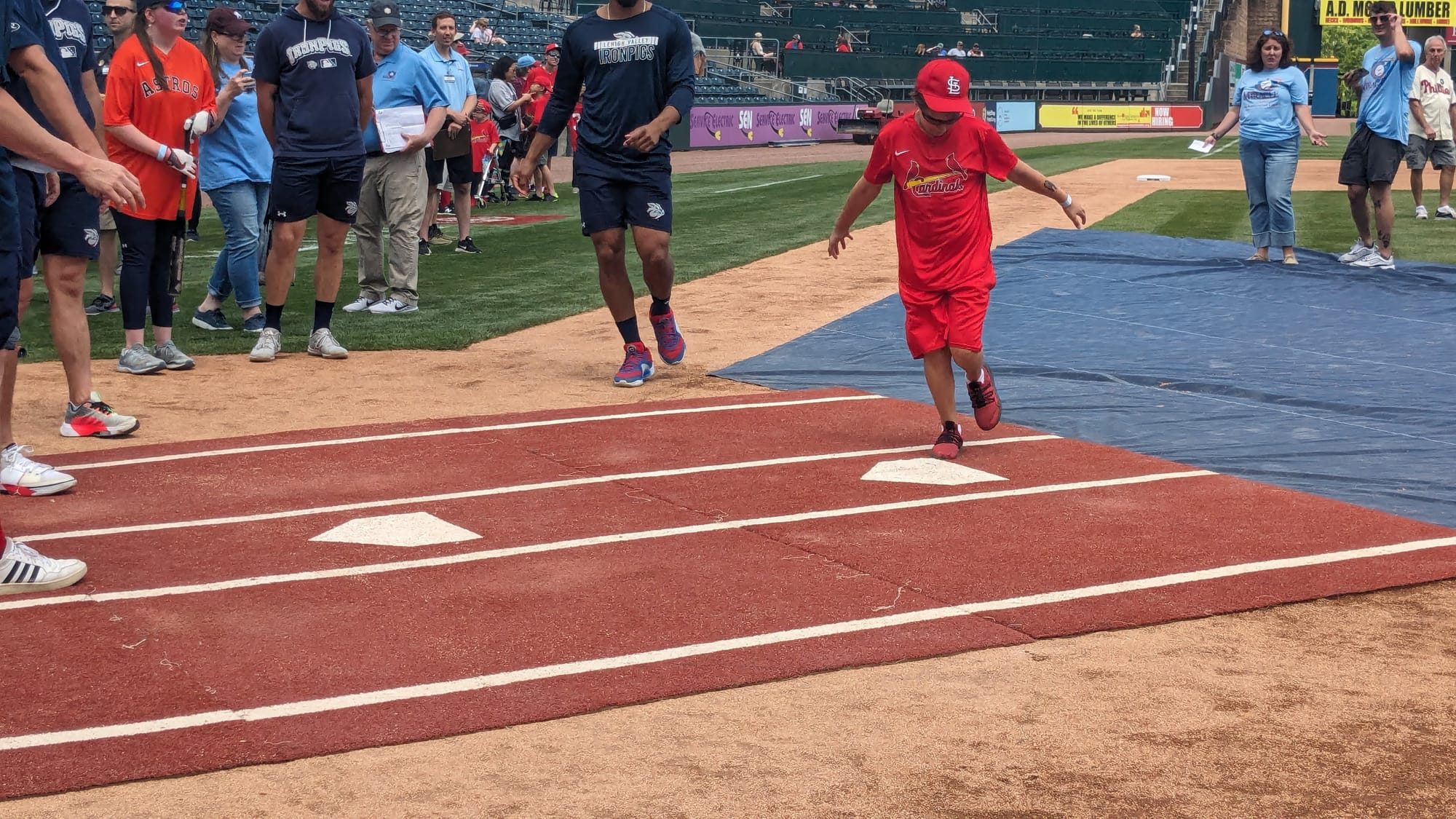 A player celebrates at home plate during an exhibition game between Miracle League of Northampton County and Miracle League o