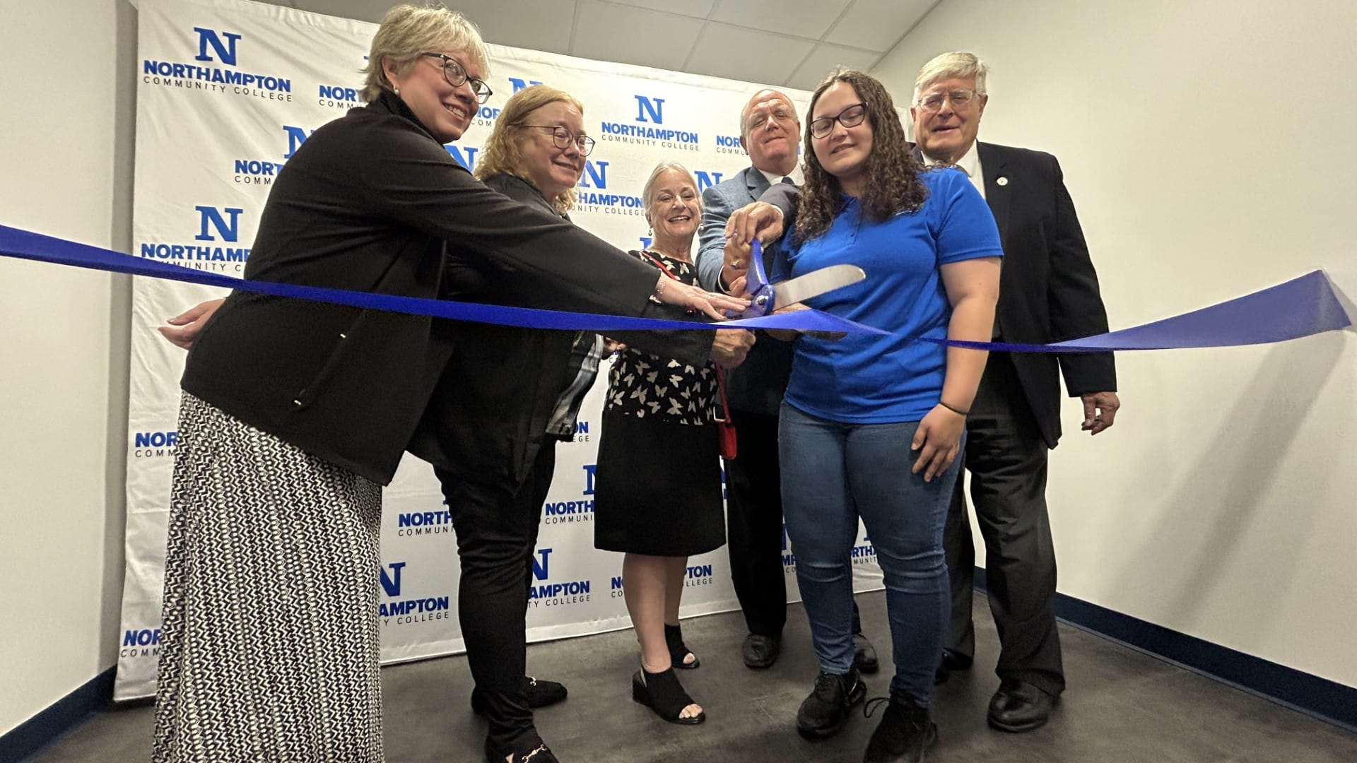 Northampton Community College officials, joined by Susan Wild, cut the ribbon on the new Interdisciplinary Healthcare Educati