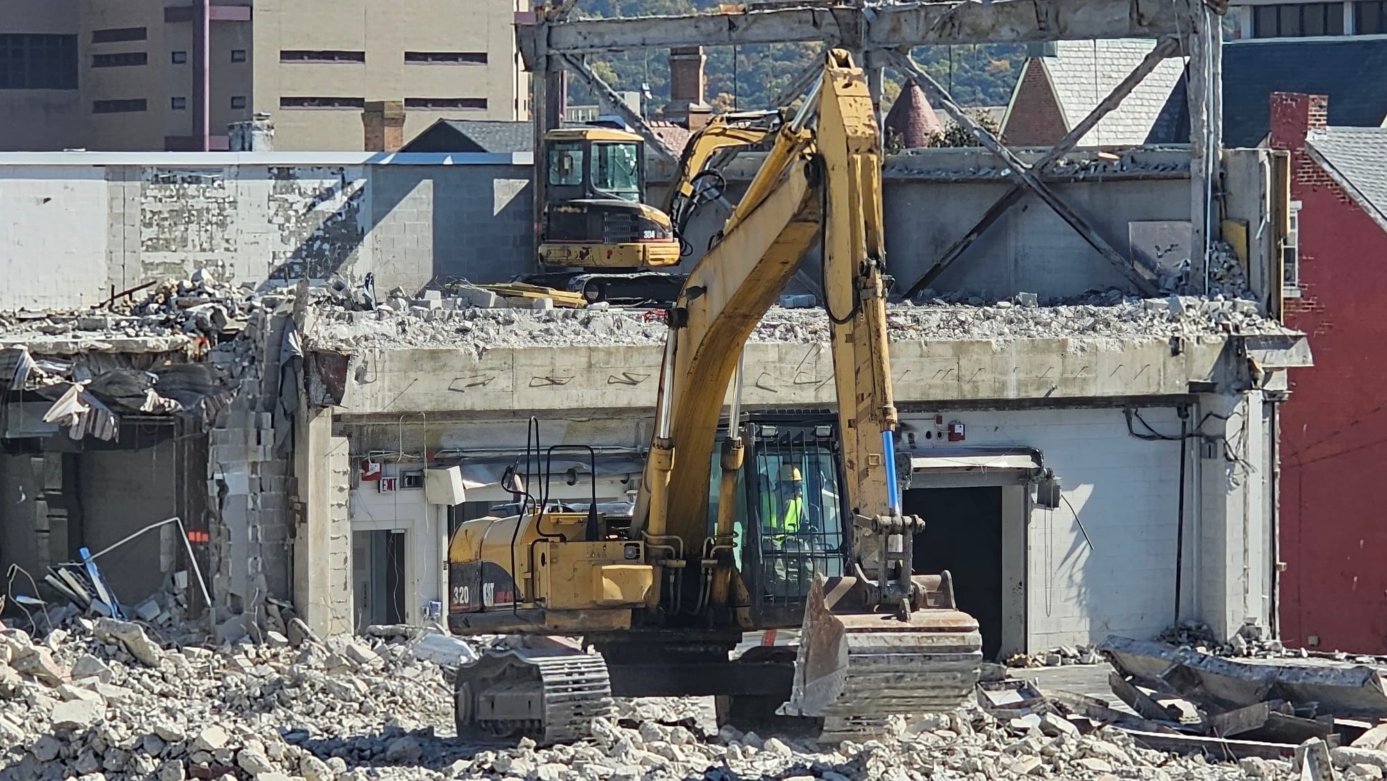 A worker digs at the demolition site at The Morning Call's former headquarters Tuesday, Oct. 24.