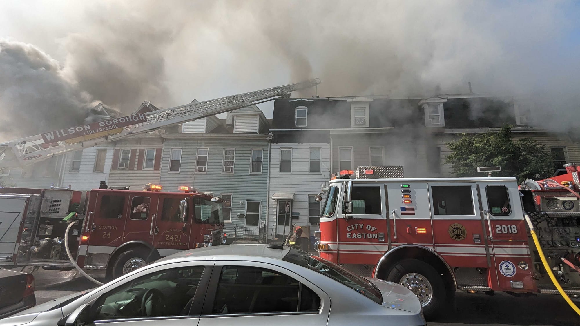 Multiple fire trucks are at the scene.