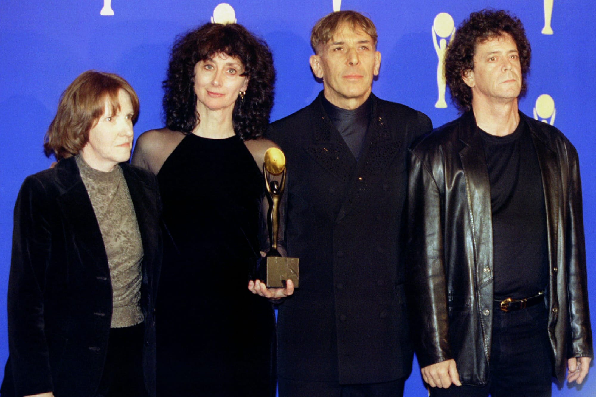 Maureen Tucker, Martha Morrison (wife of Sterling Morrison), John Cale and Lou Reed pose for photographers shortly after The 