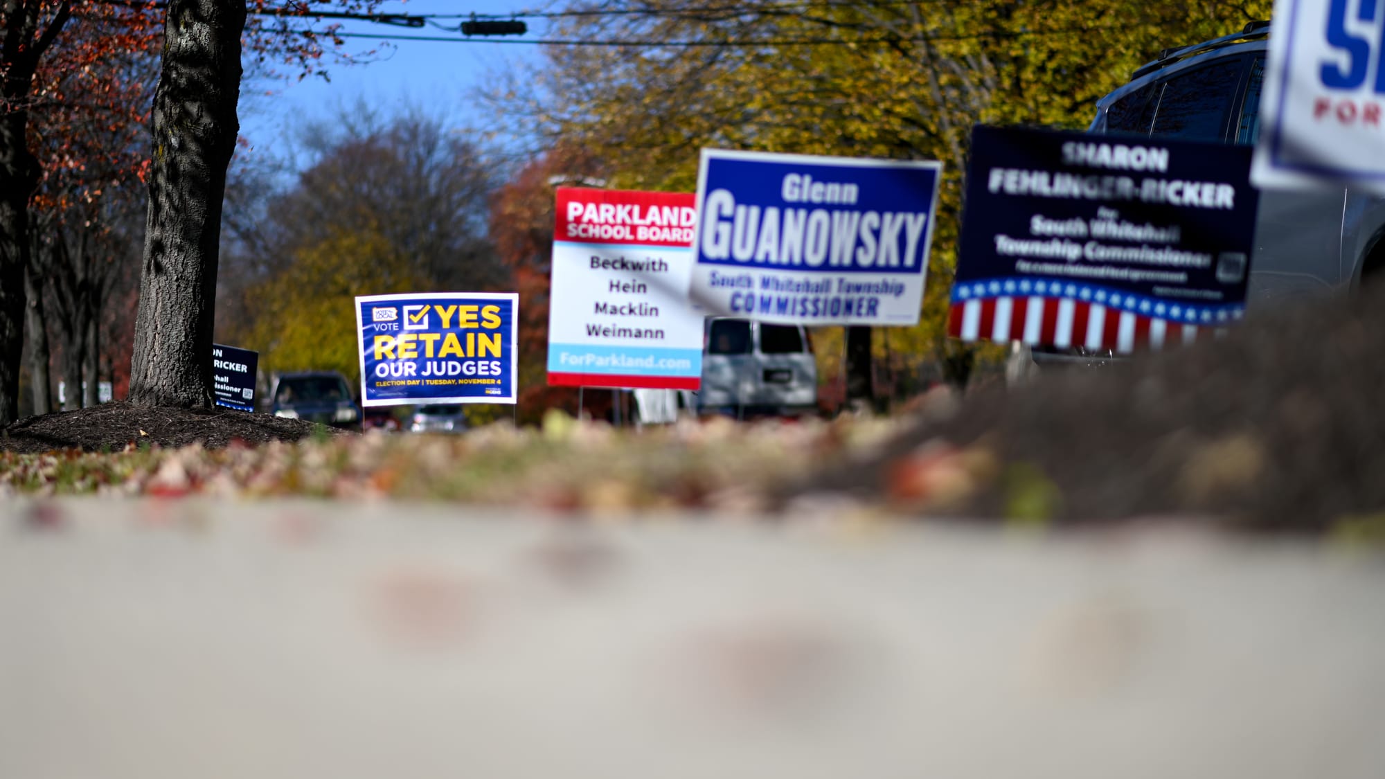 Campaign signs line the entrance to the Calvary Temple polling place on Tuesday, Nov. 4, 2025 in South Whitehall, Pa.