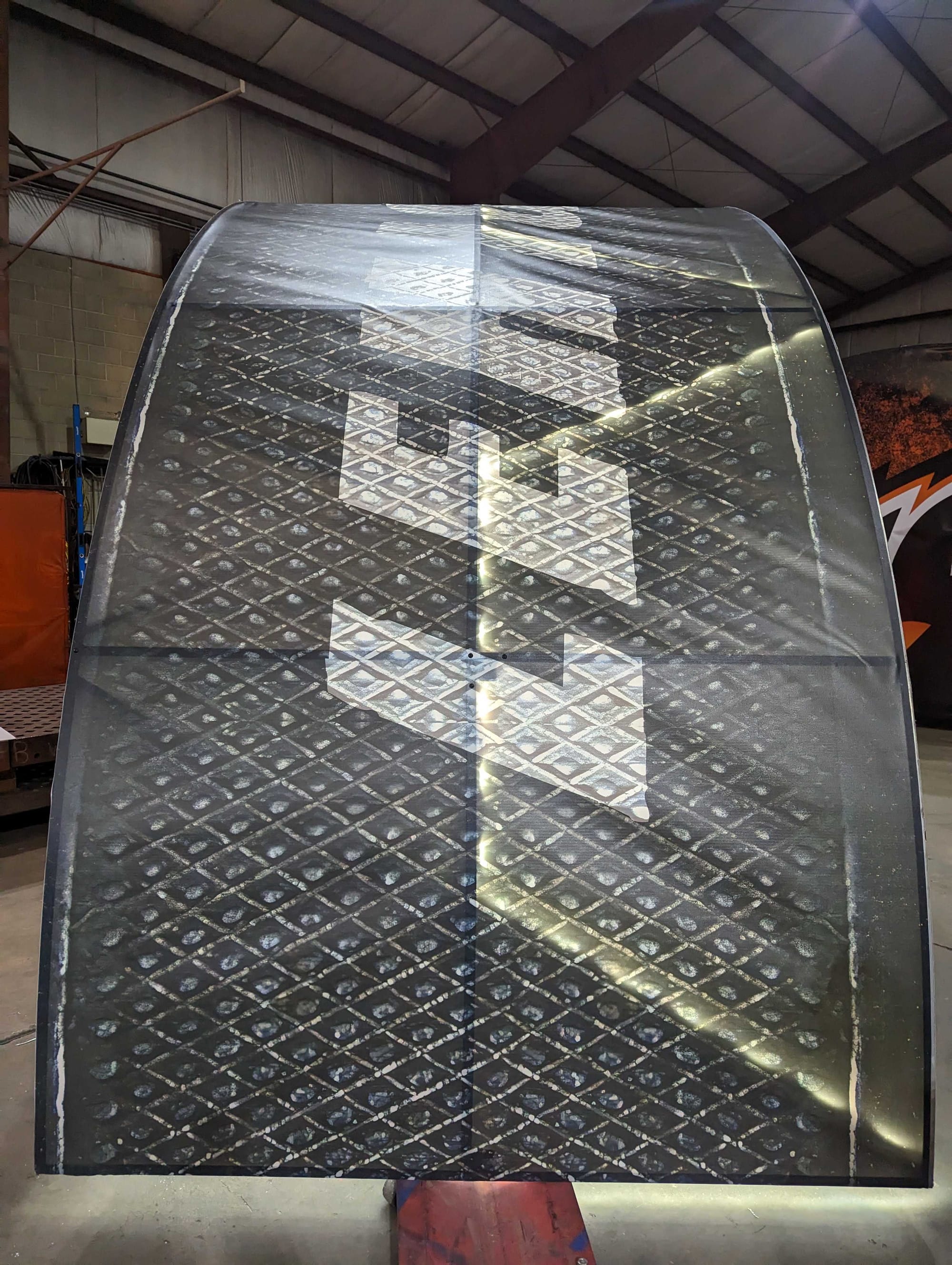 The outside of the hockey puck being built at Richmond Machine & Welding was wrapped by FastSigns of Easton.