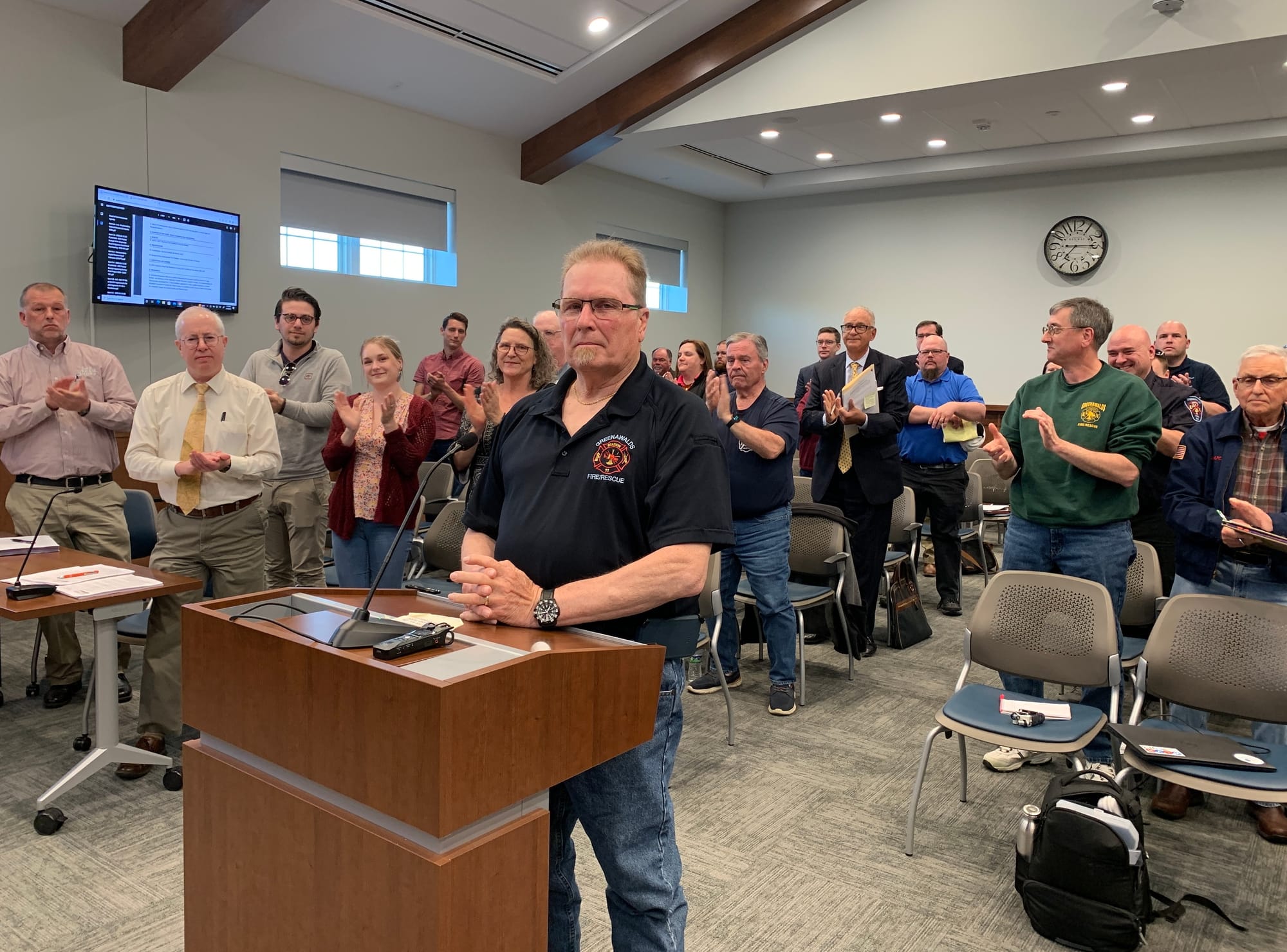 Meeting attendees applaud George Sverha of Greenawalds Fire Company.