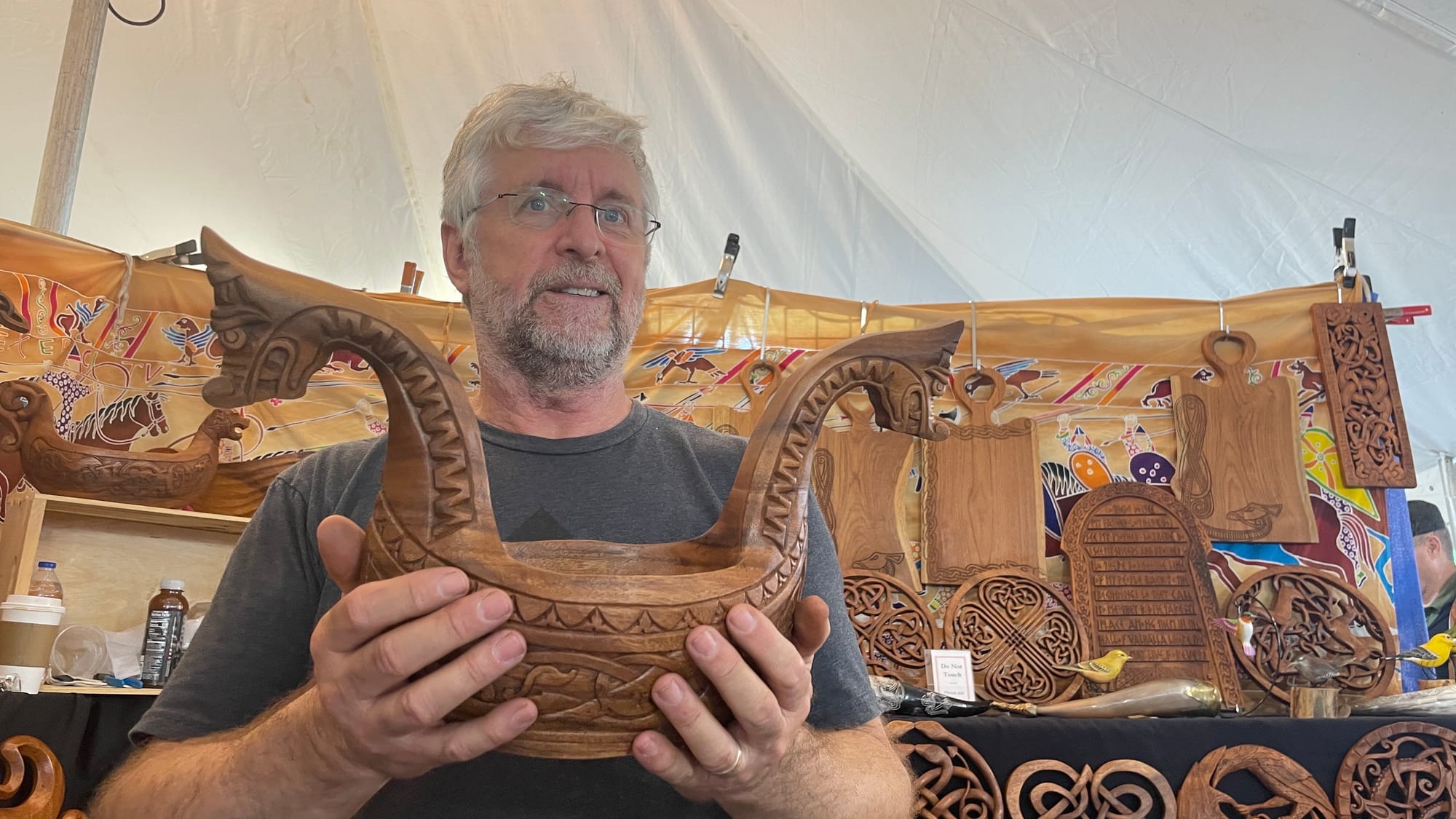 Joel Zanni with Blue Frogs Company shows off one of his prized works at the 37th showing of the Celtic Classic festival in Be