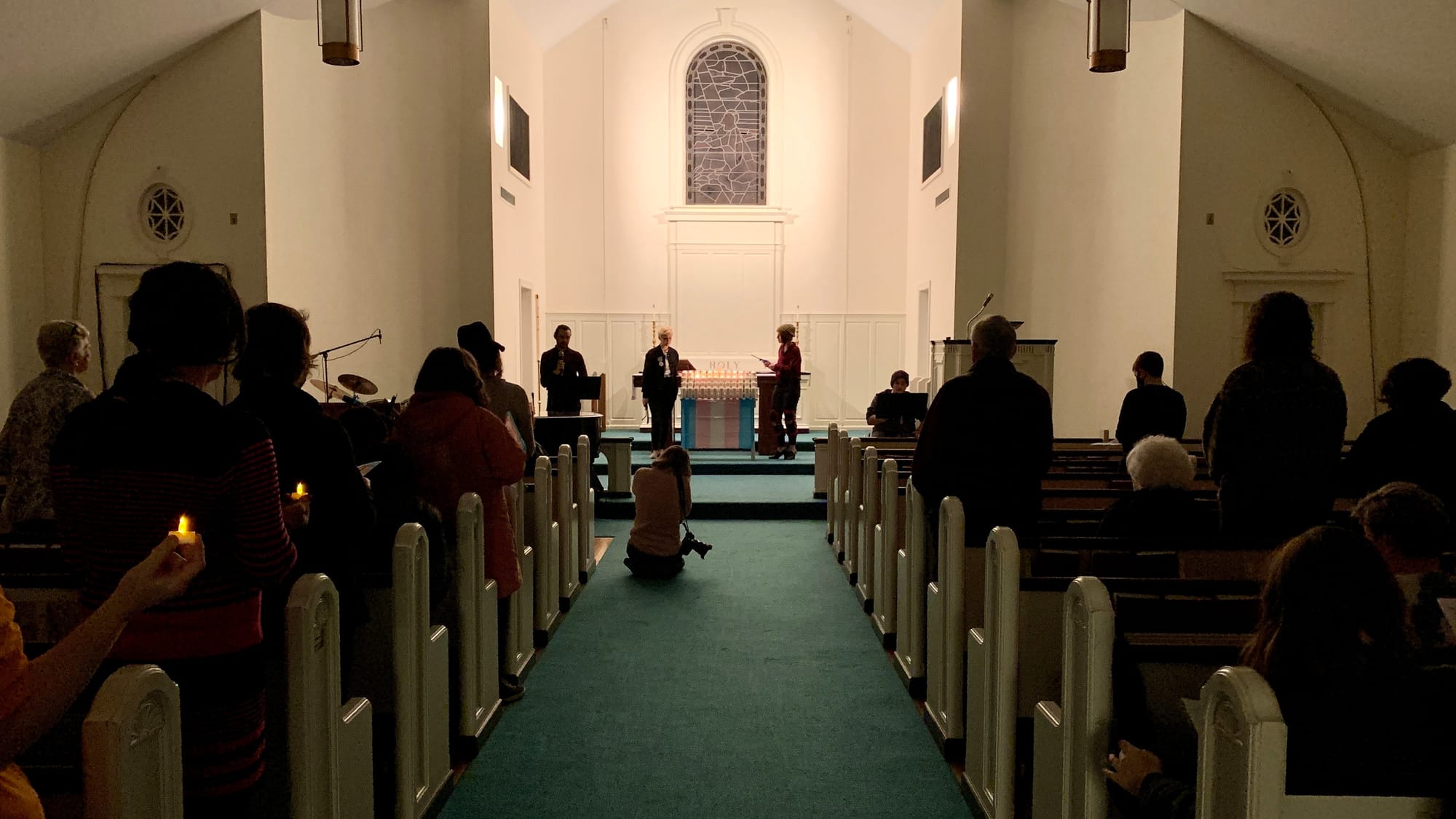 Candle lighting at the Transgender Day of Remembrance vigil.