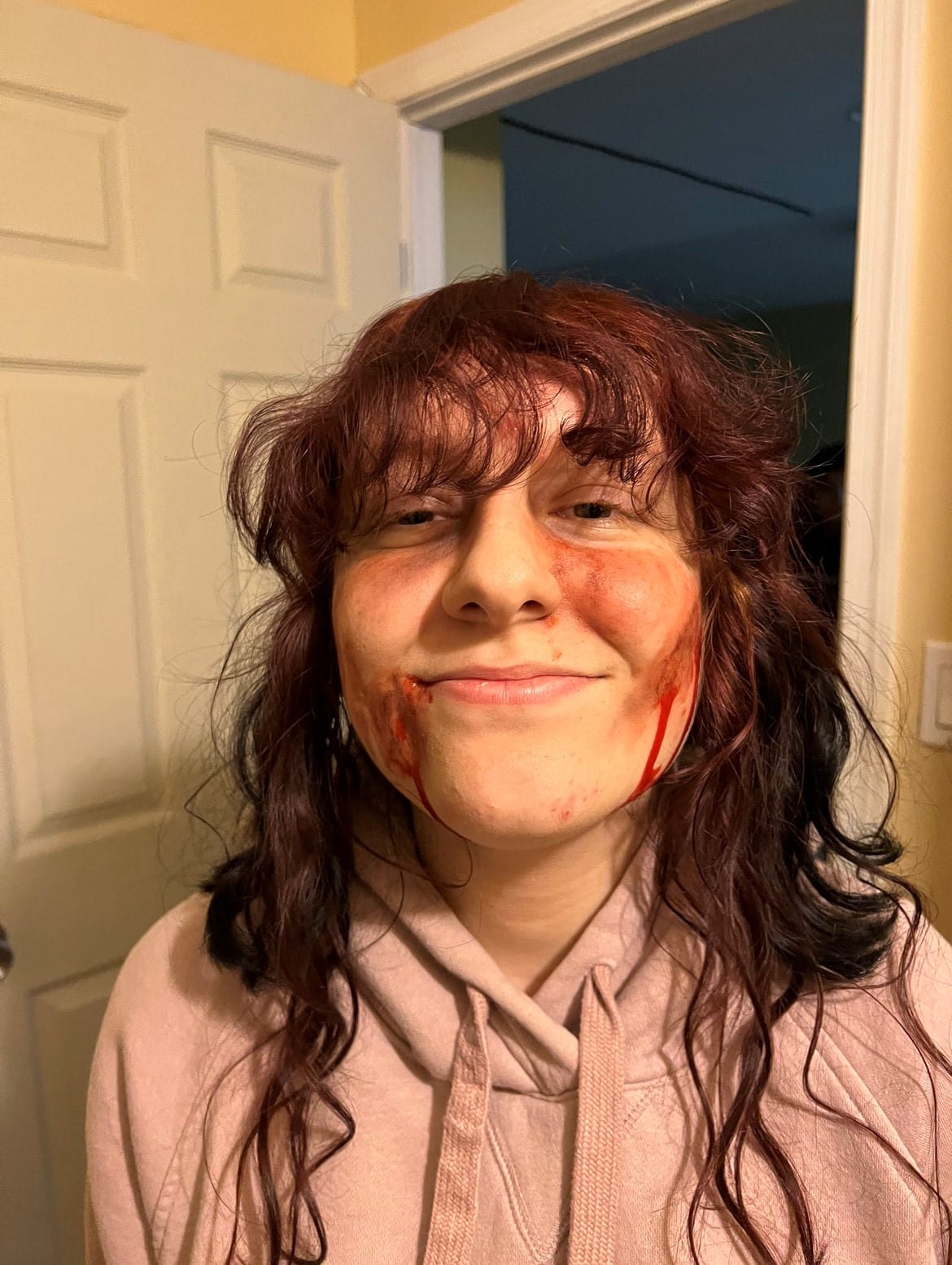 Actress Katelyn Smoyer on set with makeup for a horror scene
