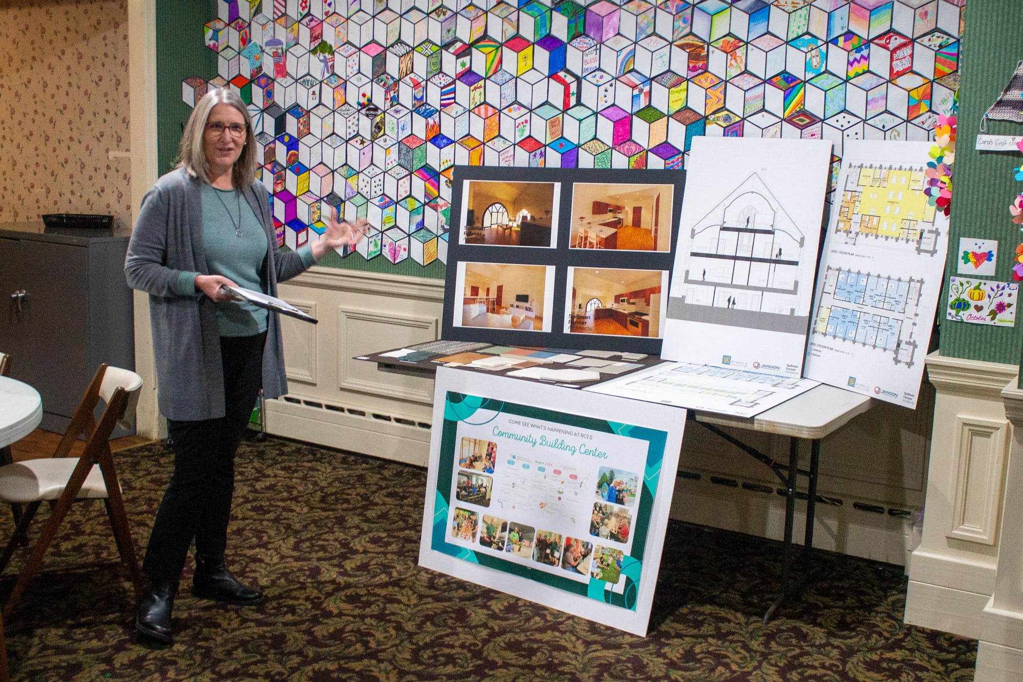 Ripple Community Inc. Executive Director Sherri Binder demonstrates some photos of their upcoming housing project in Allentow