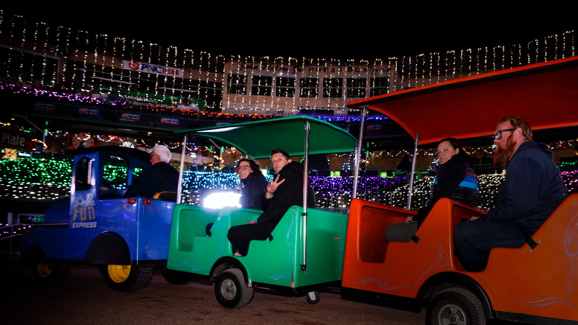 Visitors ride a train around the infield. The Lehigh Valley IronPigs are hosting Illumination, a display of brilliant lights 
