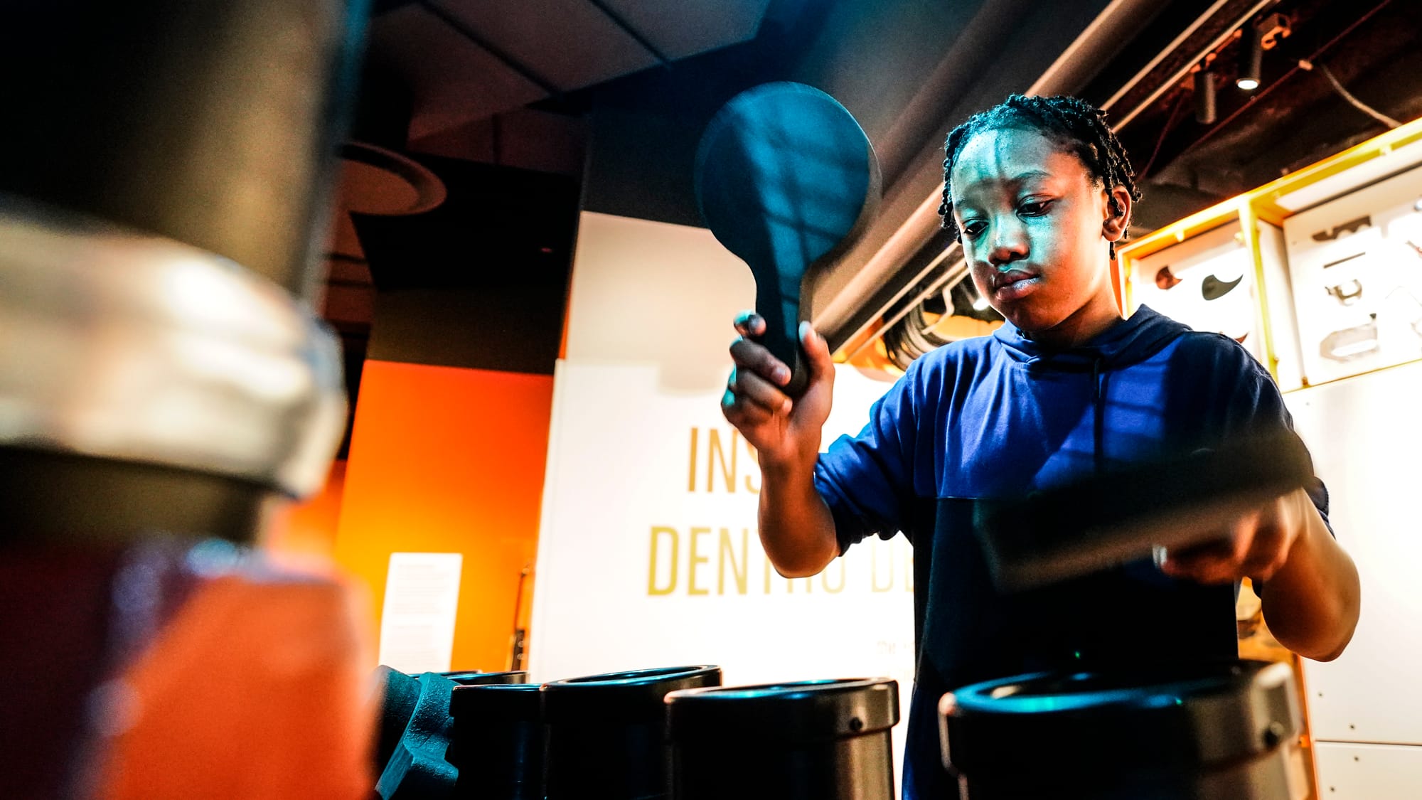 A student makes percussive sounds with the Victaulic tubes on display. The Da Vinci Science Center at 815 Hamilton Street, Al