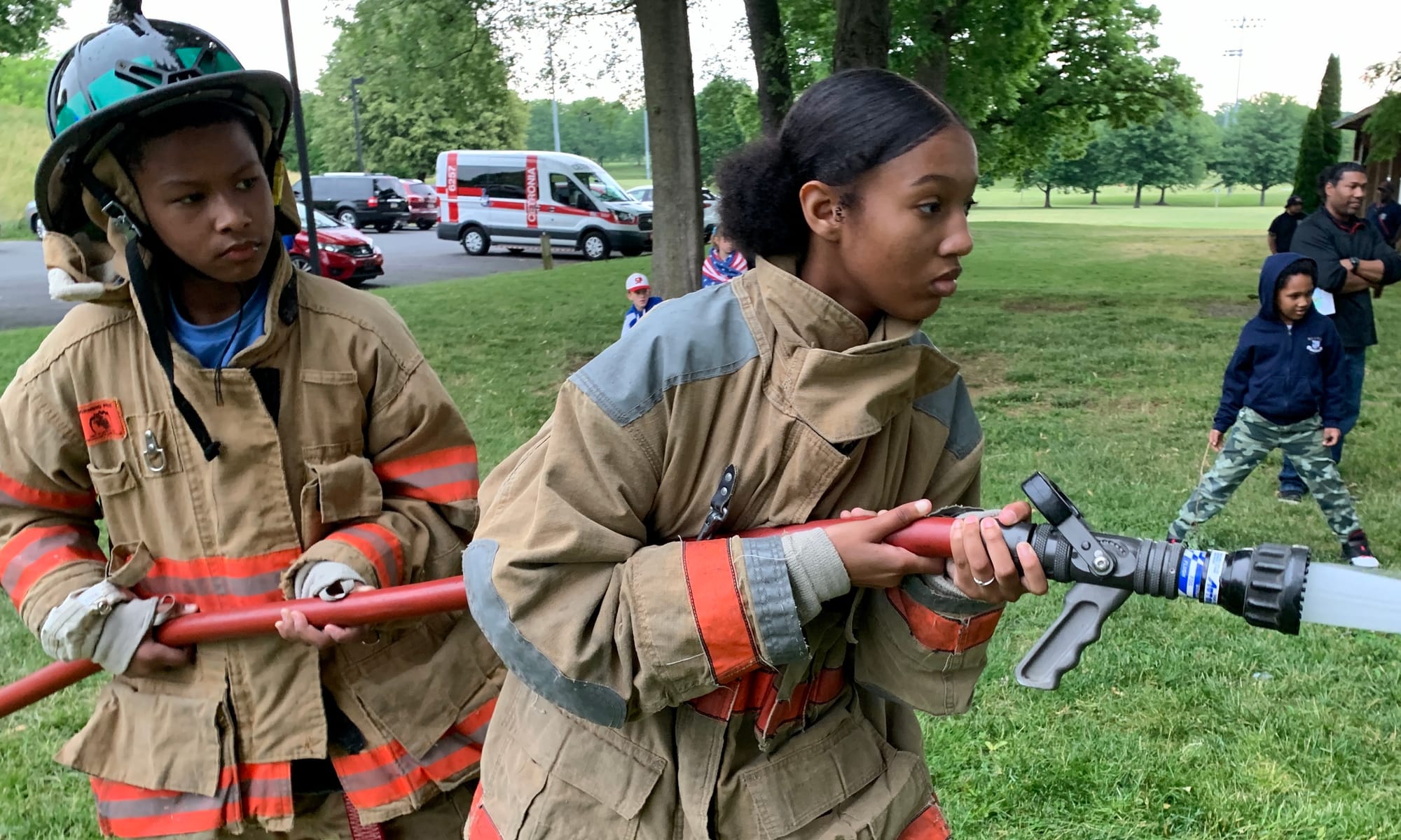 Camp attendee Chloe Henry participates in a firefighting demonstration.
