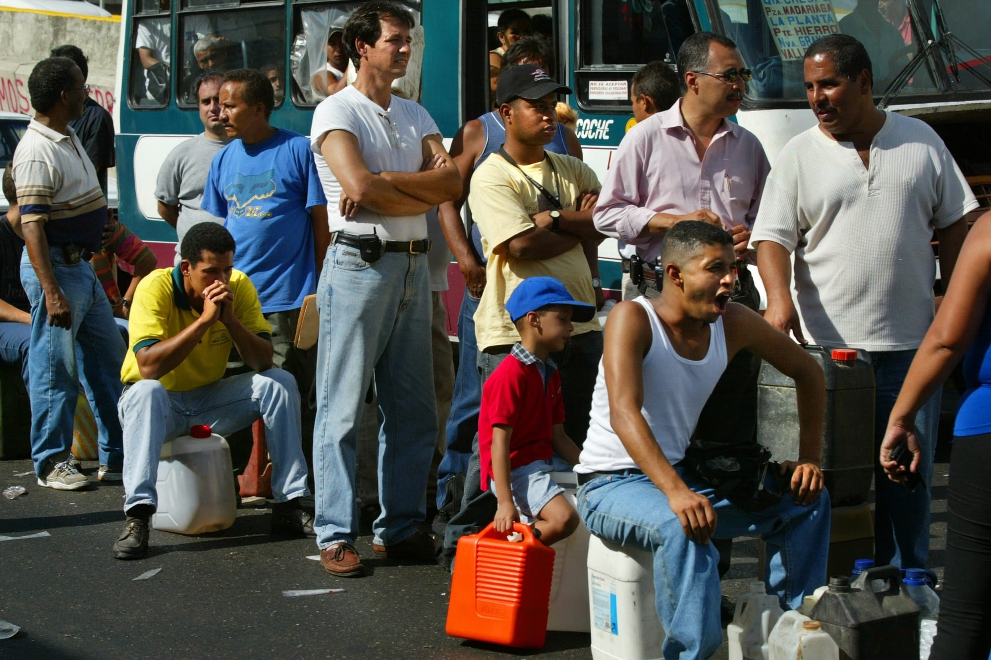 Venezuelans wait for hours in gas lines in Caracas on Dec. 21, 2002, the 20th day of a general strike protesting Chavez's rul