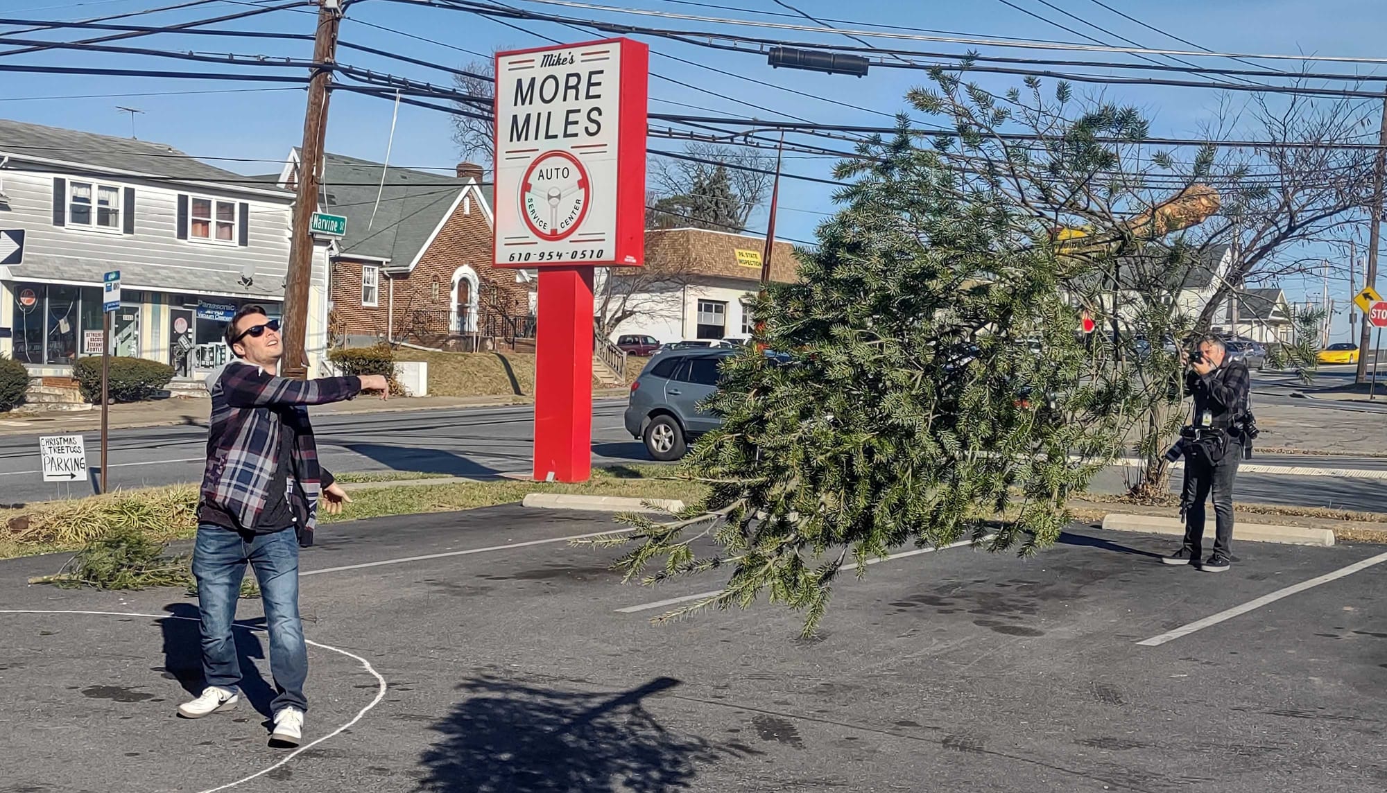 Nathan West, of Nazareth, chucks the Christmas Tree at the annual Christmas tree toss in Bethlehem, Saturday Dec. 16, 2023.