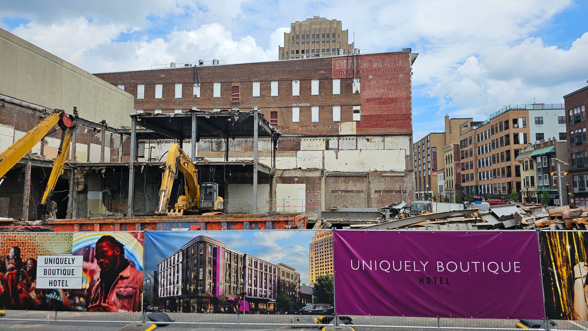 Demolition crews are tearing down a row of buildings in the 900 block of Hamilton Street, where City Center is planning a fiv