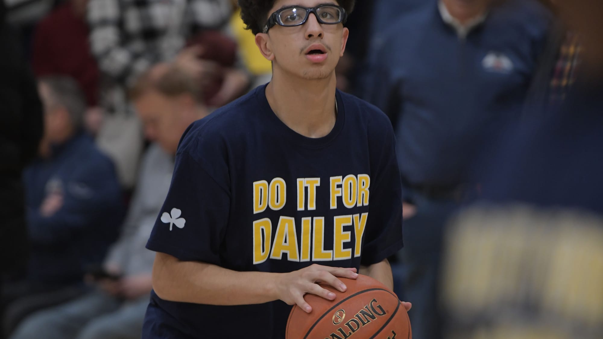 Players warm up before a court dedication for Jeff Dailey on Friday, December 1, 2023, at Notre Dame-Green Pond High School.