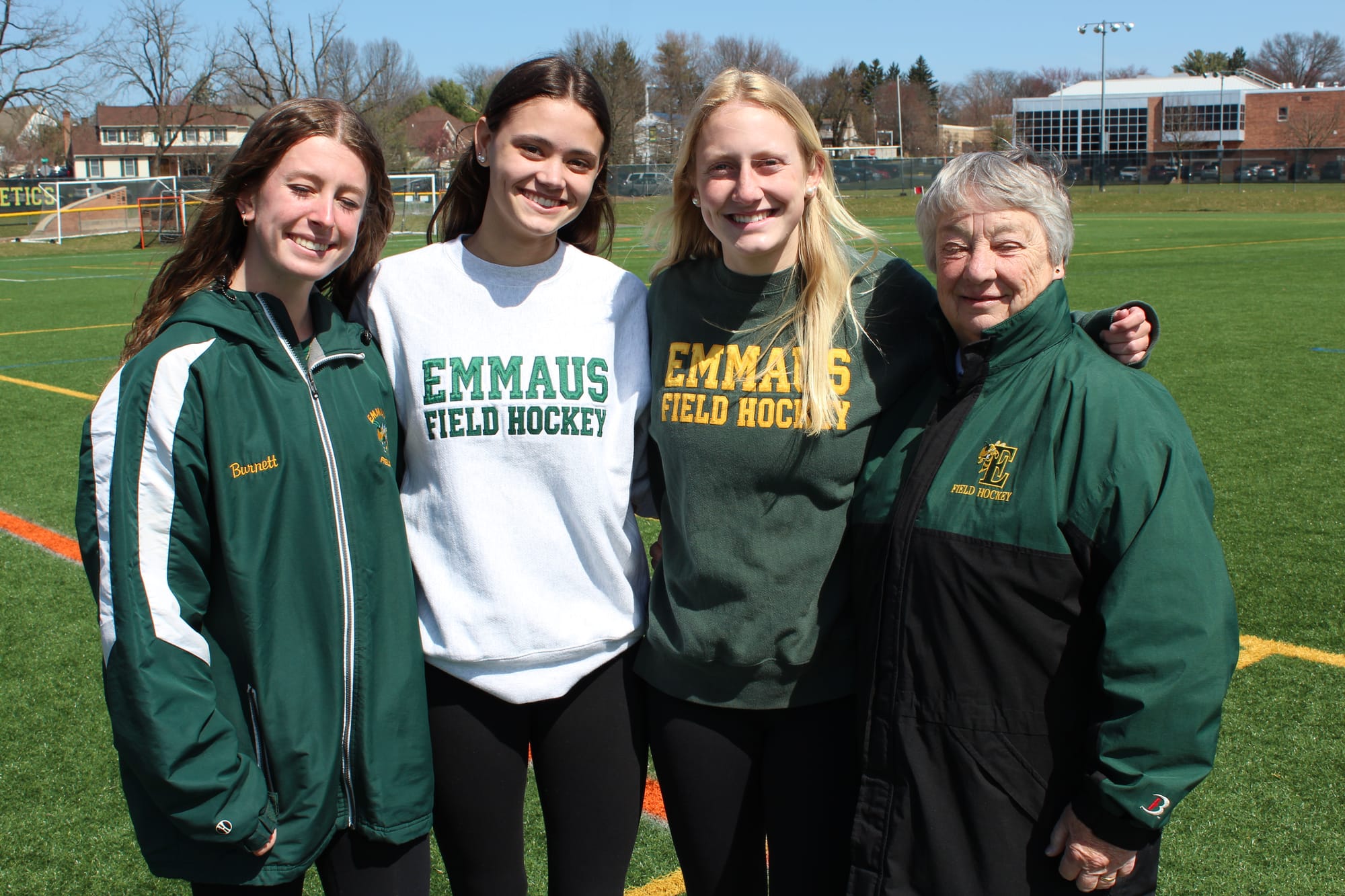 Coach Butz-Stavin with seniors Rachel Herbine, Abby Burnett and Ava Zerfass