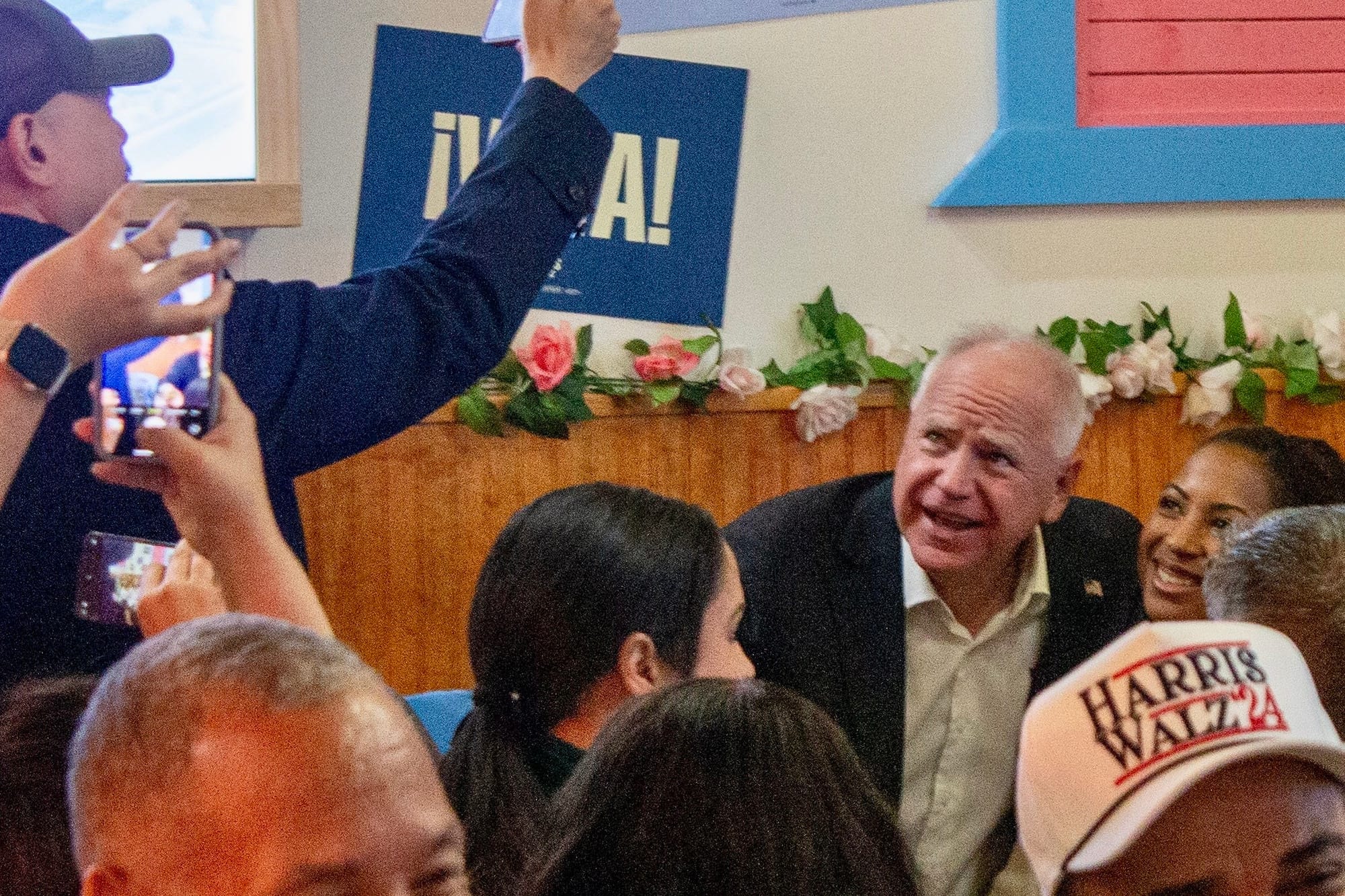 Minnesota Gov. Tim Walz posed with supporters at El Tipico restaurant in Salilsbury Township Friday, Oct. 25, 2024