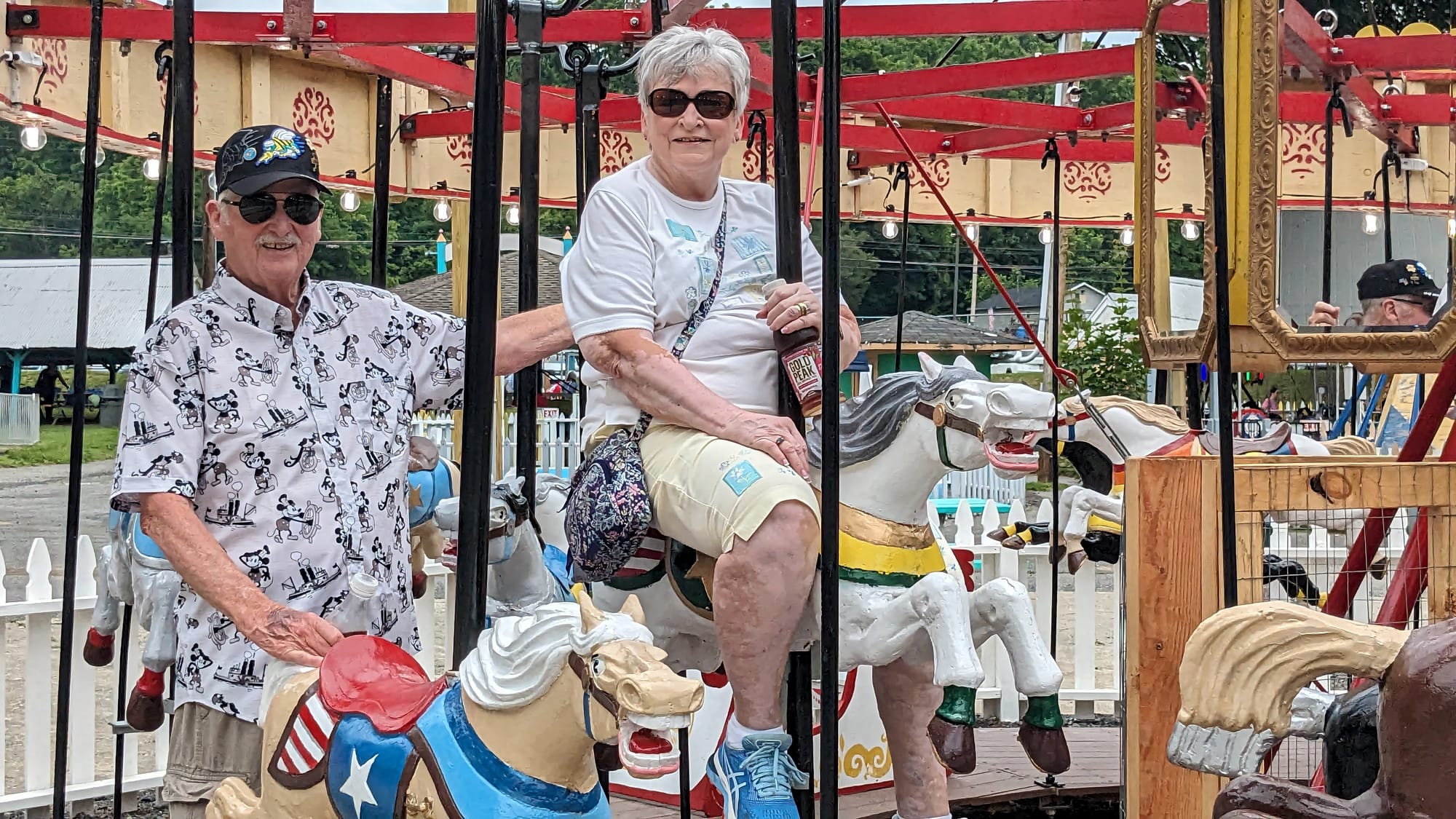 Lynette and Charles Transue ride the newly-installed carousel at Bushkill Park Sunday afternoon. The couple used to visit the