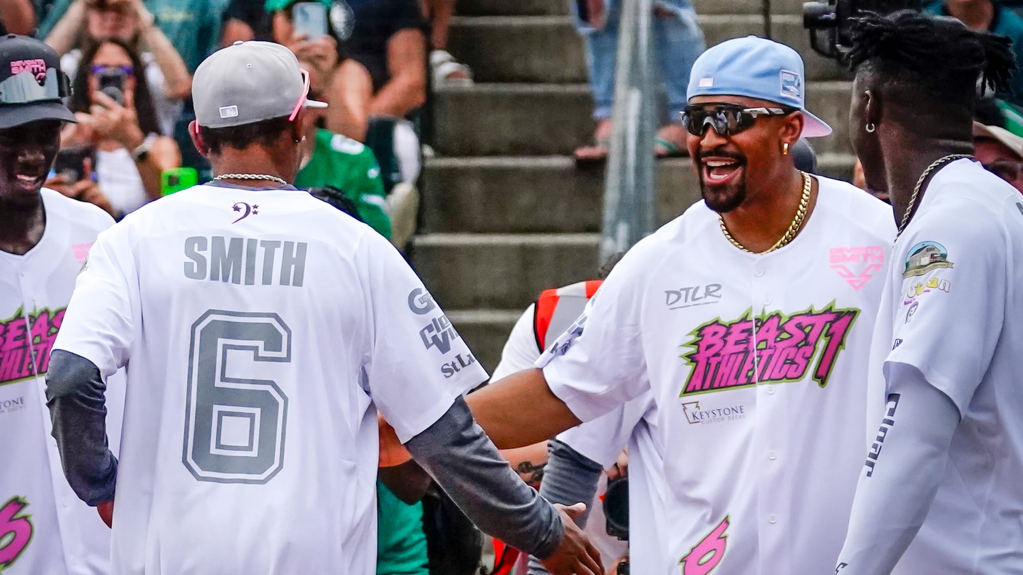 DeVonta Smith is greeted at home by Jalen Hurts after hitting a home run. The annual Devonta Smith Celebrity Softball Game fe