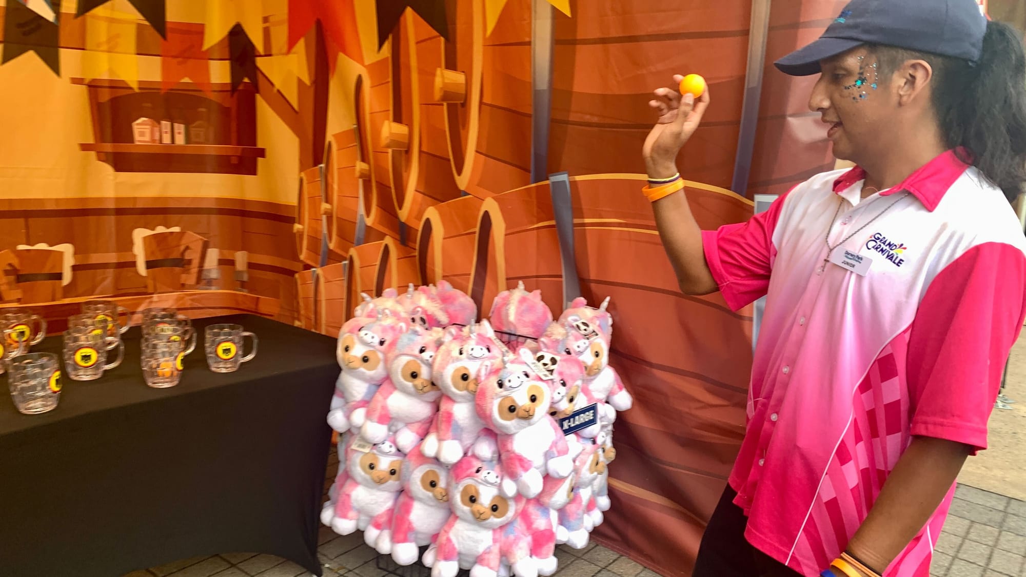 A Dorney Park employee plays one of the Grand Carnivale games.