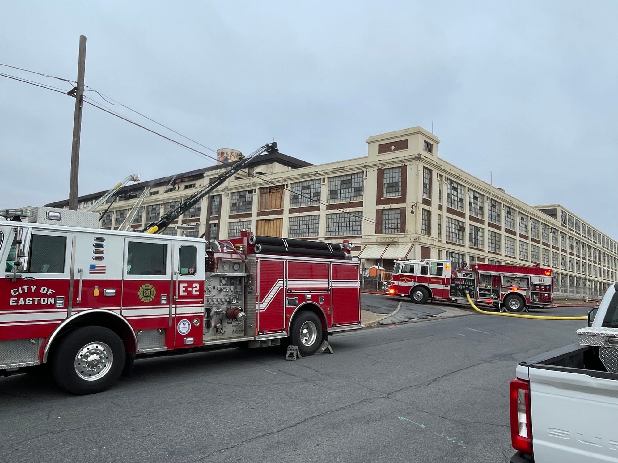 Firefighters respond Friday morning to the site of the old Dixie Cup factory after a fire broke out in the structure.