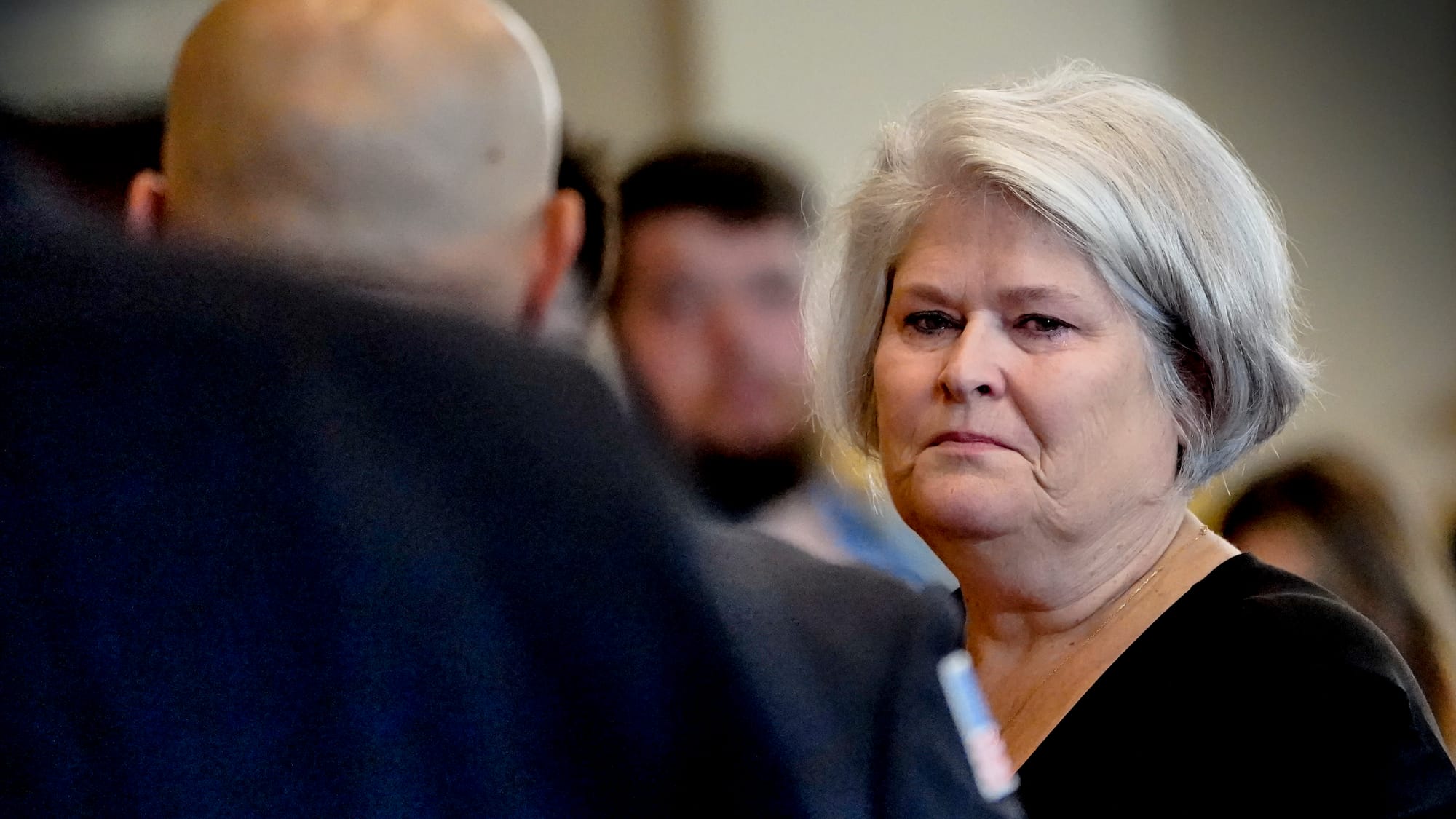 Andrea Kiskeravage greets mourners. A Mass of Christian Burial was held at the Cathedral of S. Catharine of Siena for the lat