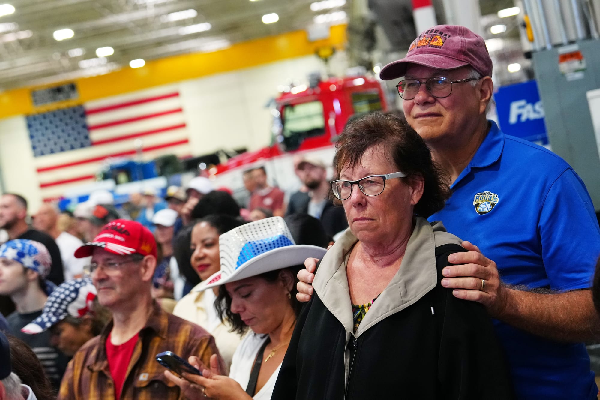 People listen to President Donald Trump speak at a Mack Trucks facility, Tuesday, June 23, 2026, in Macungie, Pa.