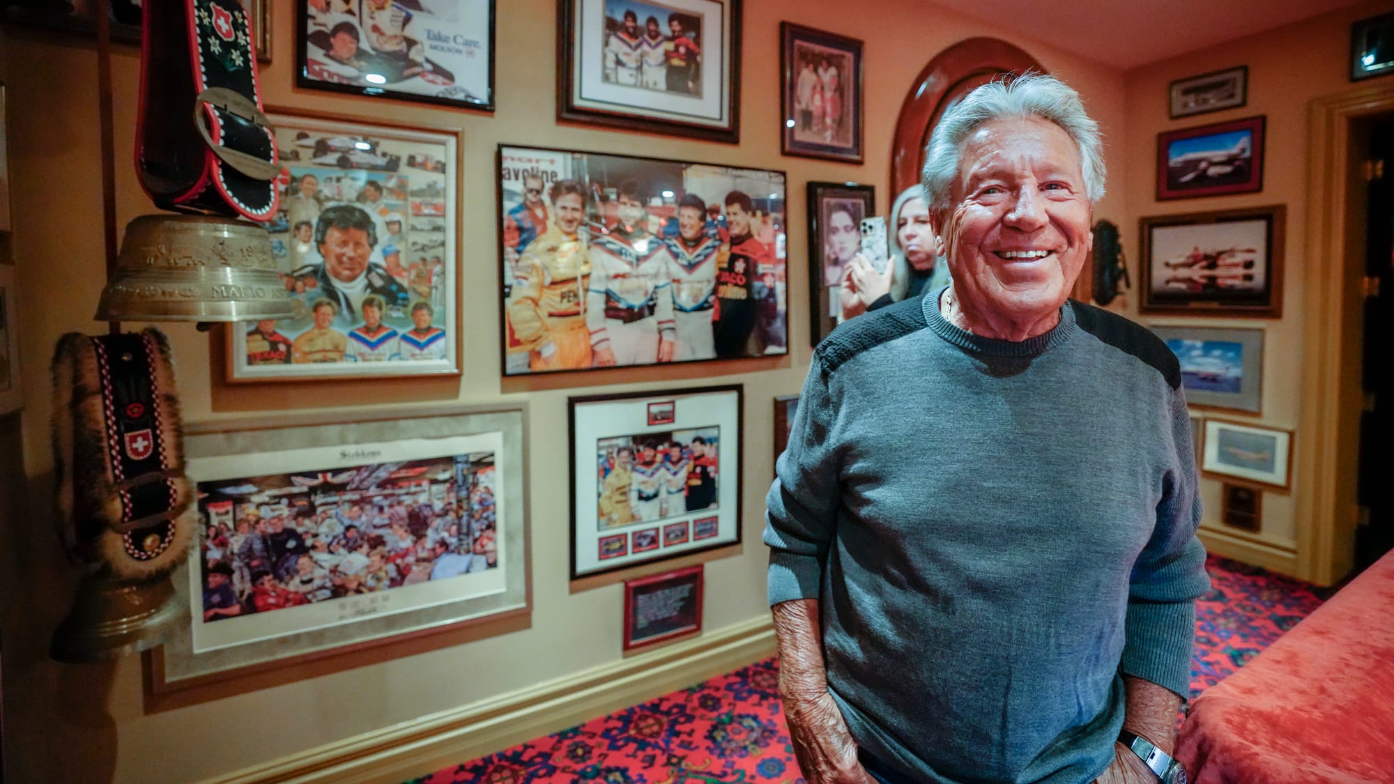 Race driver Mario Andretti poses for a portrait in the basement at his home in Nazareth, Pa. on Wednesday, March 20, 2024. Ph