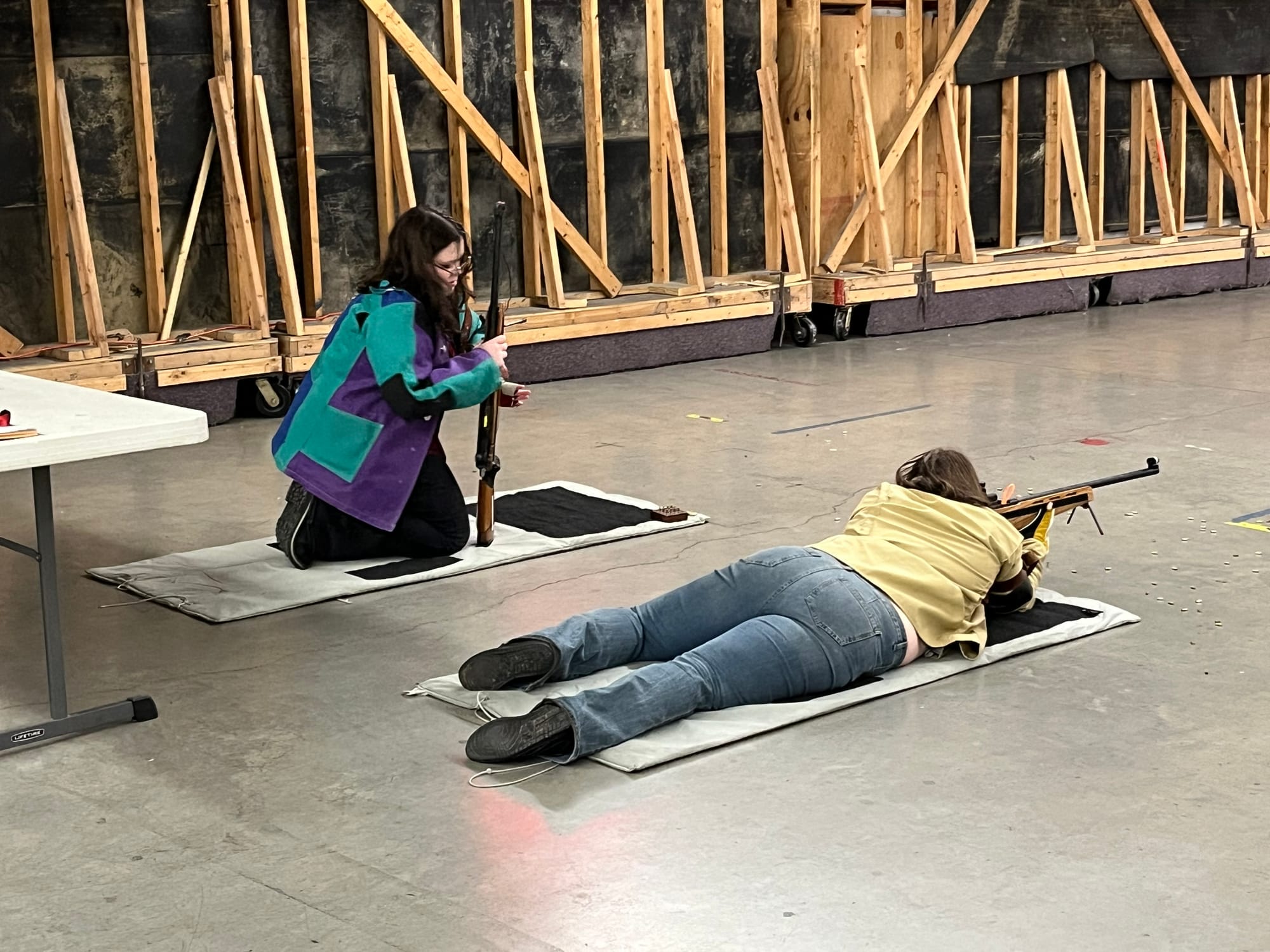Salisbury's Madyson Faustner, right, sights her target while teammate Sarah Vaughn checks her rifle before they are given the