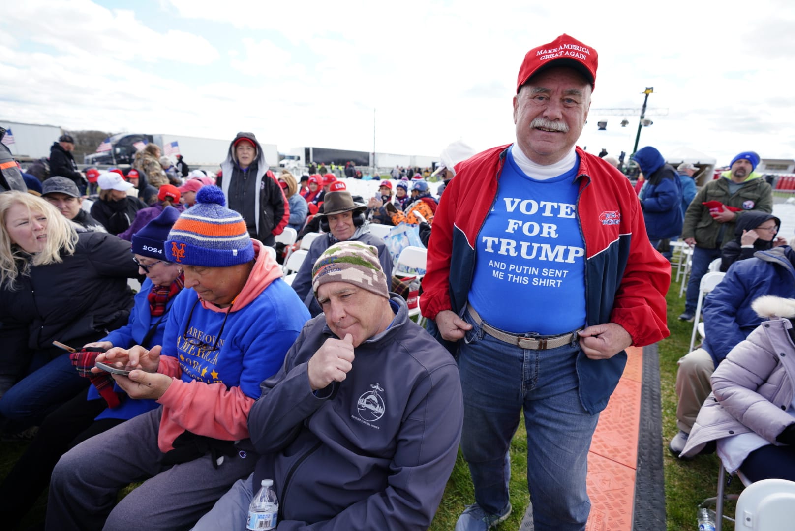 People wait for Donald Trump prior to a rally in Schnecksville on Saturday, April 13, 2024.