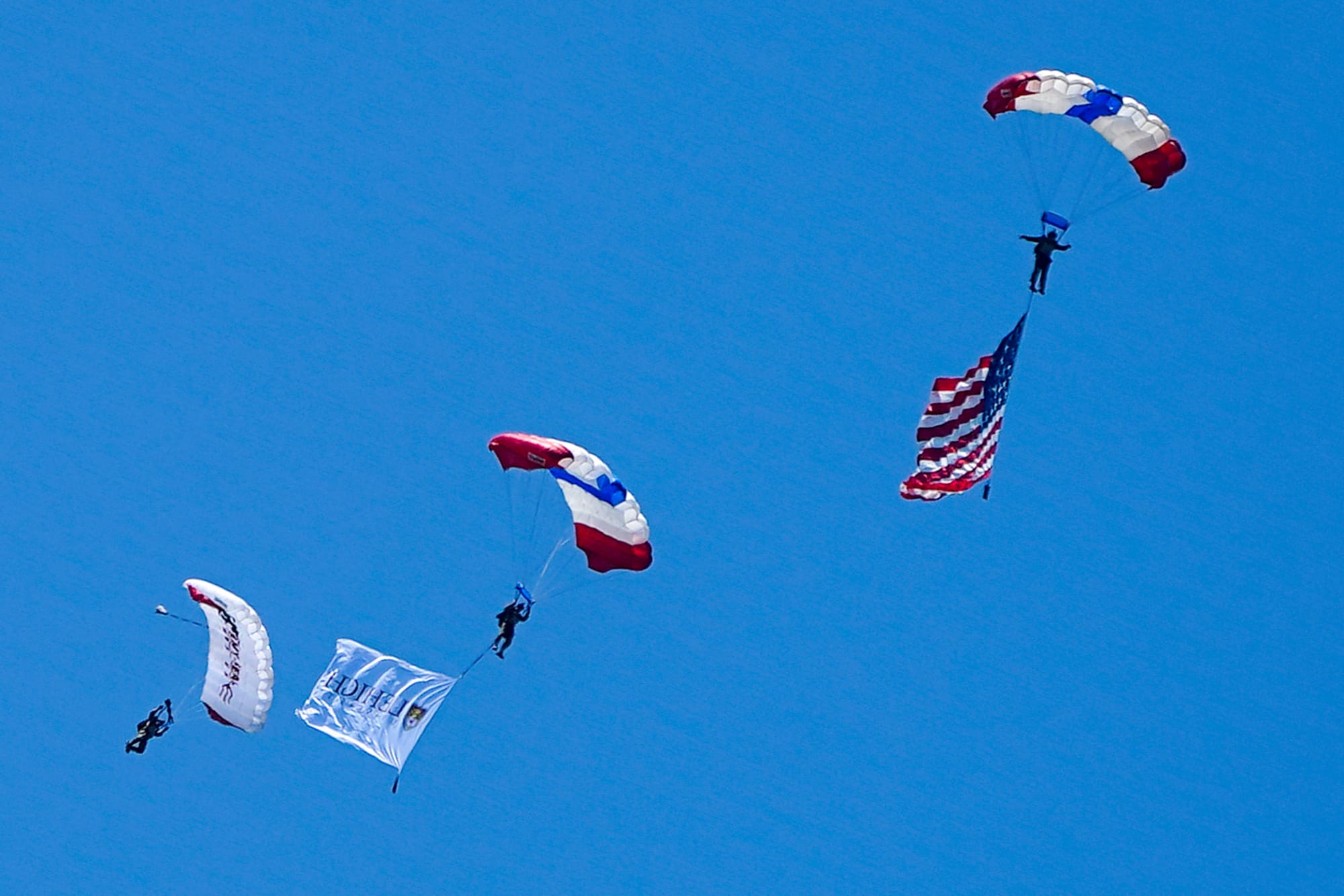U.S. Special Forces members including U.S. Navy SEALs skydive from 4,000' onto the field near Goodman Stadium at Lehigh Unive