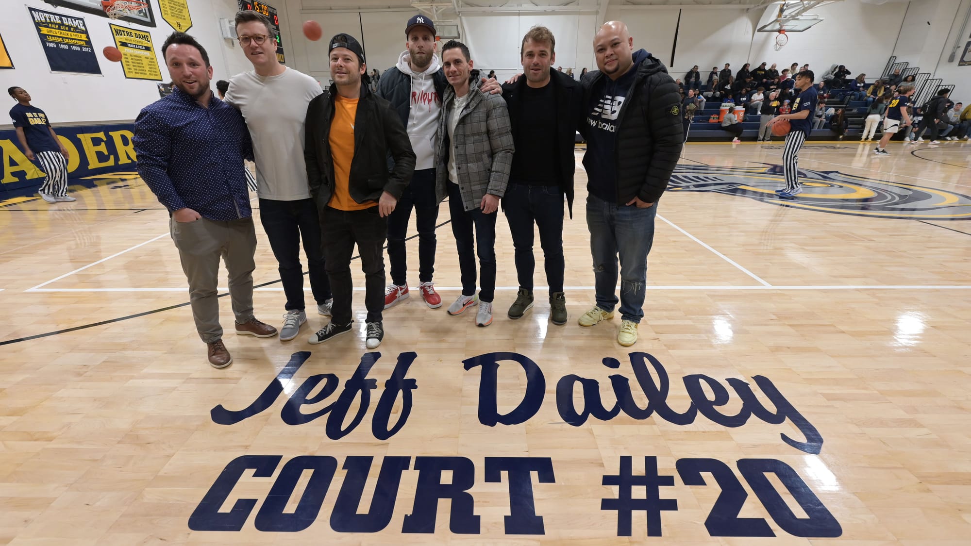 Former teammates of Jeff Dailey, gather before a court dedication for Jeff Dailey on Friday, December 1, 2023, at Notre Dame-