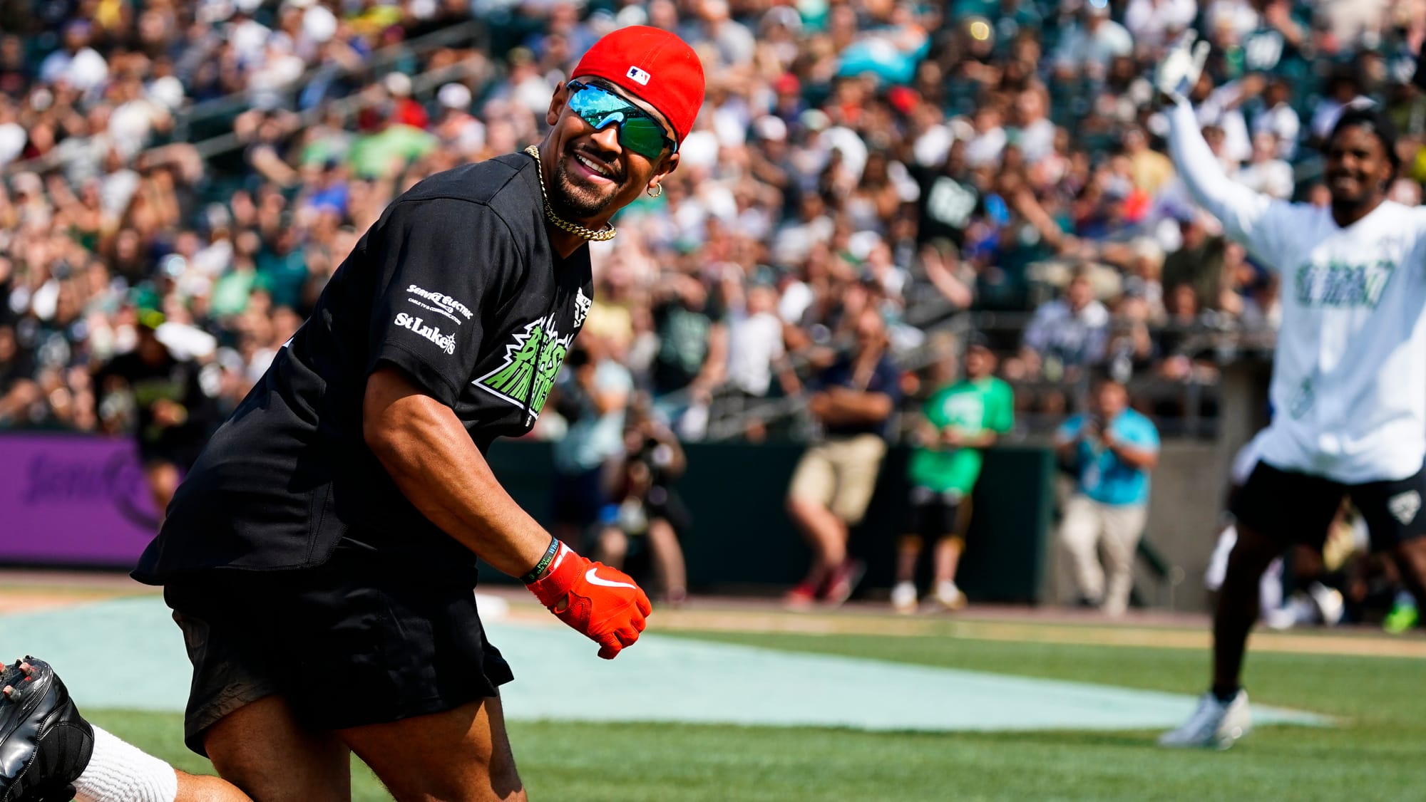 Jalen Hurts scores a run. The 2nd annual DeVonta Smith Celebrity Softball Game was held at Coca-Cola Park in Allentown on Sat