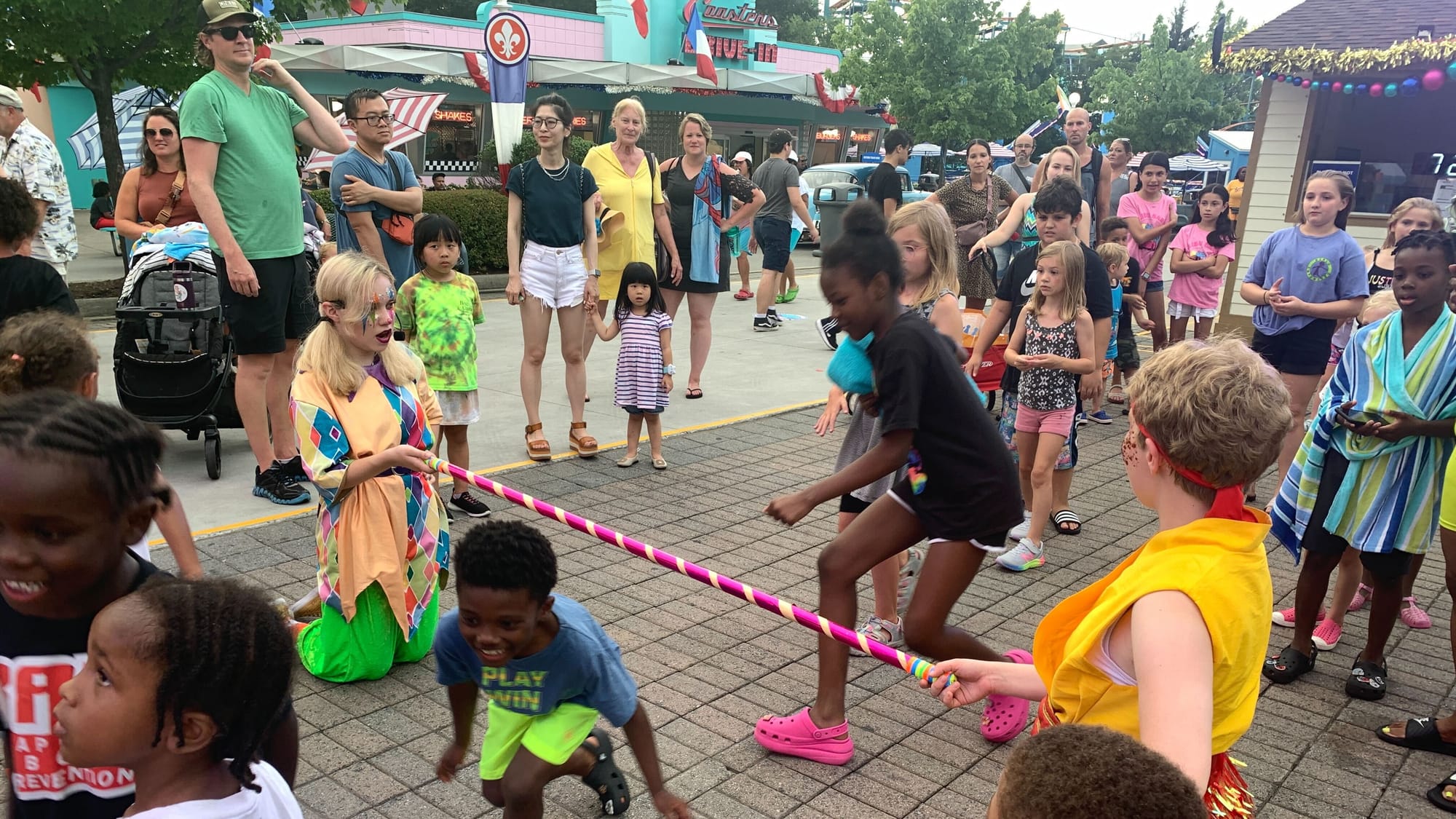 Kids play limbo at Dorney Park's Grand Carnivale.