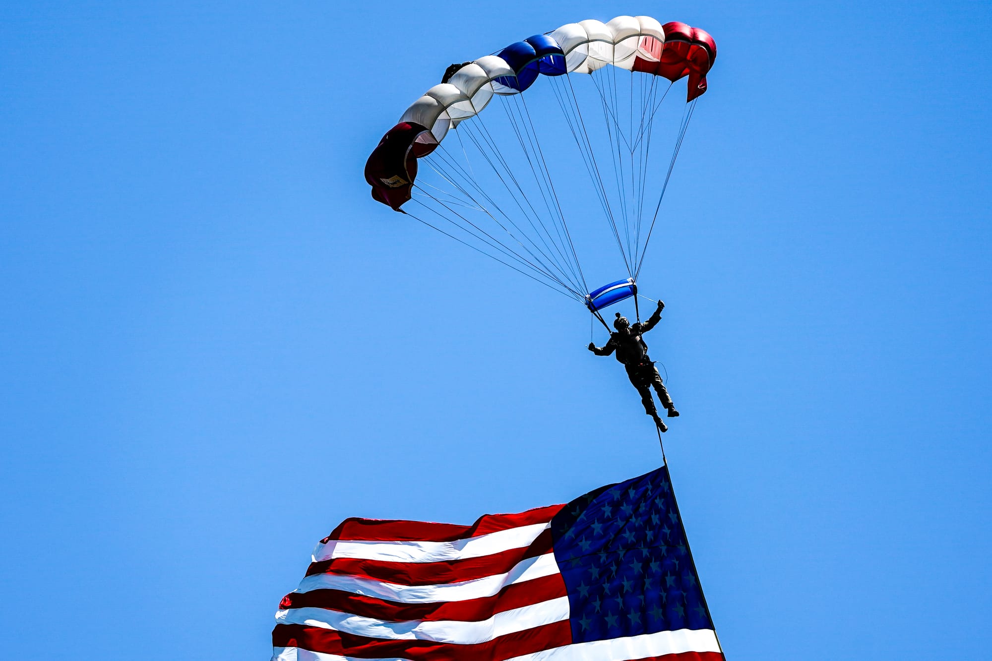 U.S. Special Forces members including U.S. Navy SEALs skydive from 4,000' onto the field near Goodman Stadium at Lehigh Unive
