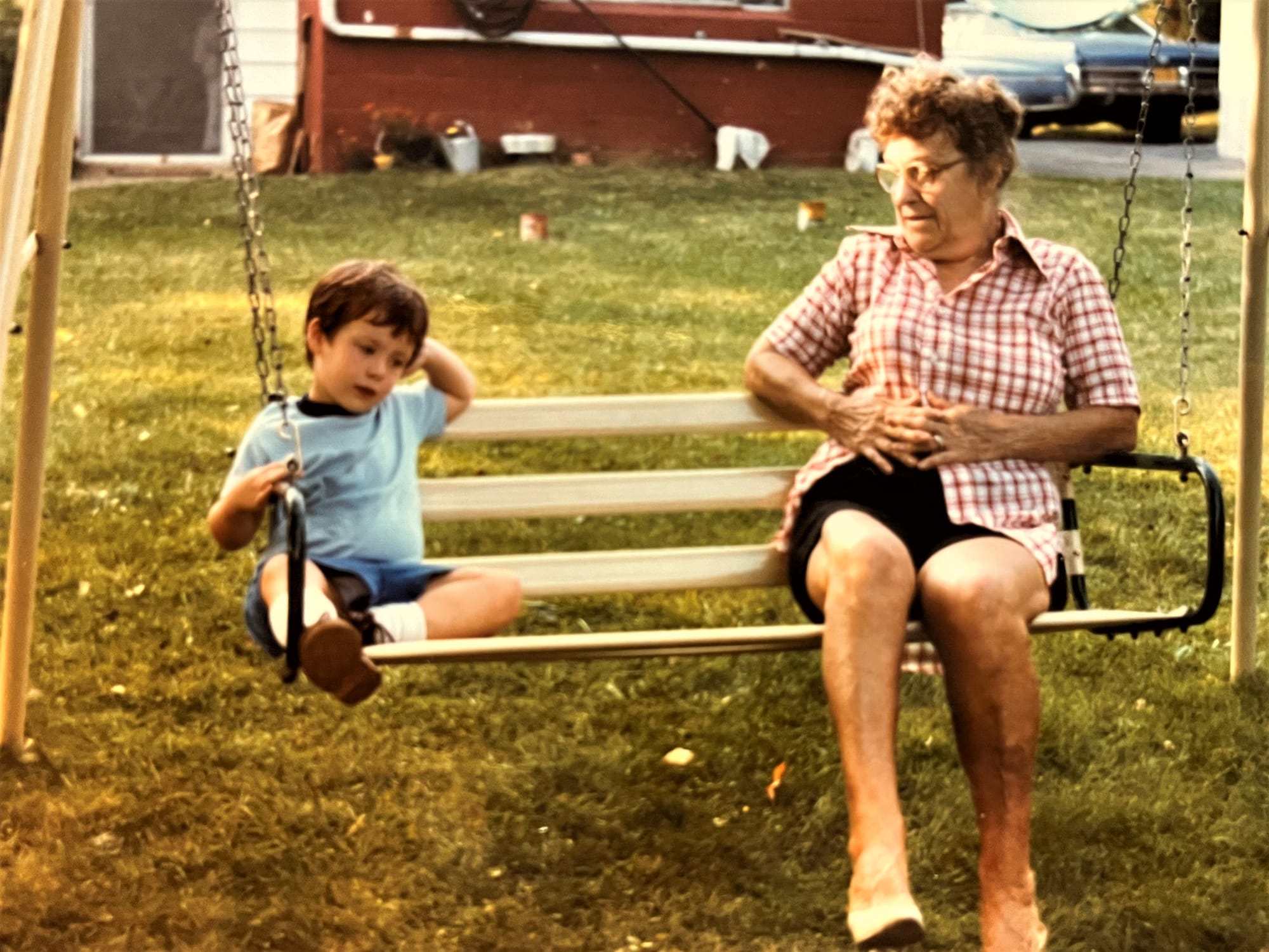 Young Brad Wlazelek and his grandmother, Gerda Fenstermaker, share a swing.