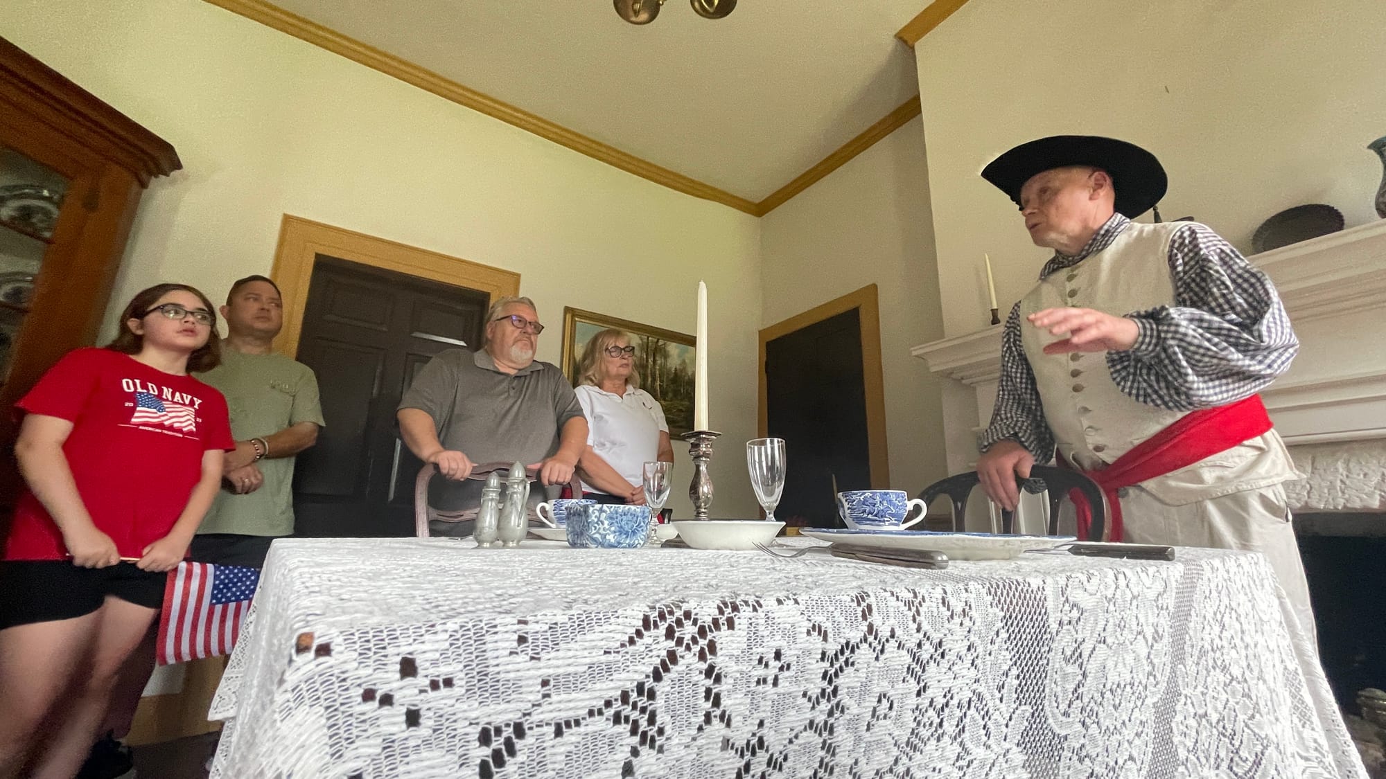 Rick Guth, representing Col. George Taylor, shows a group around one of the "dining" rooms of the George Taylor House.