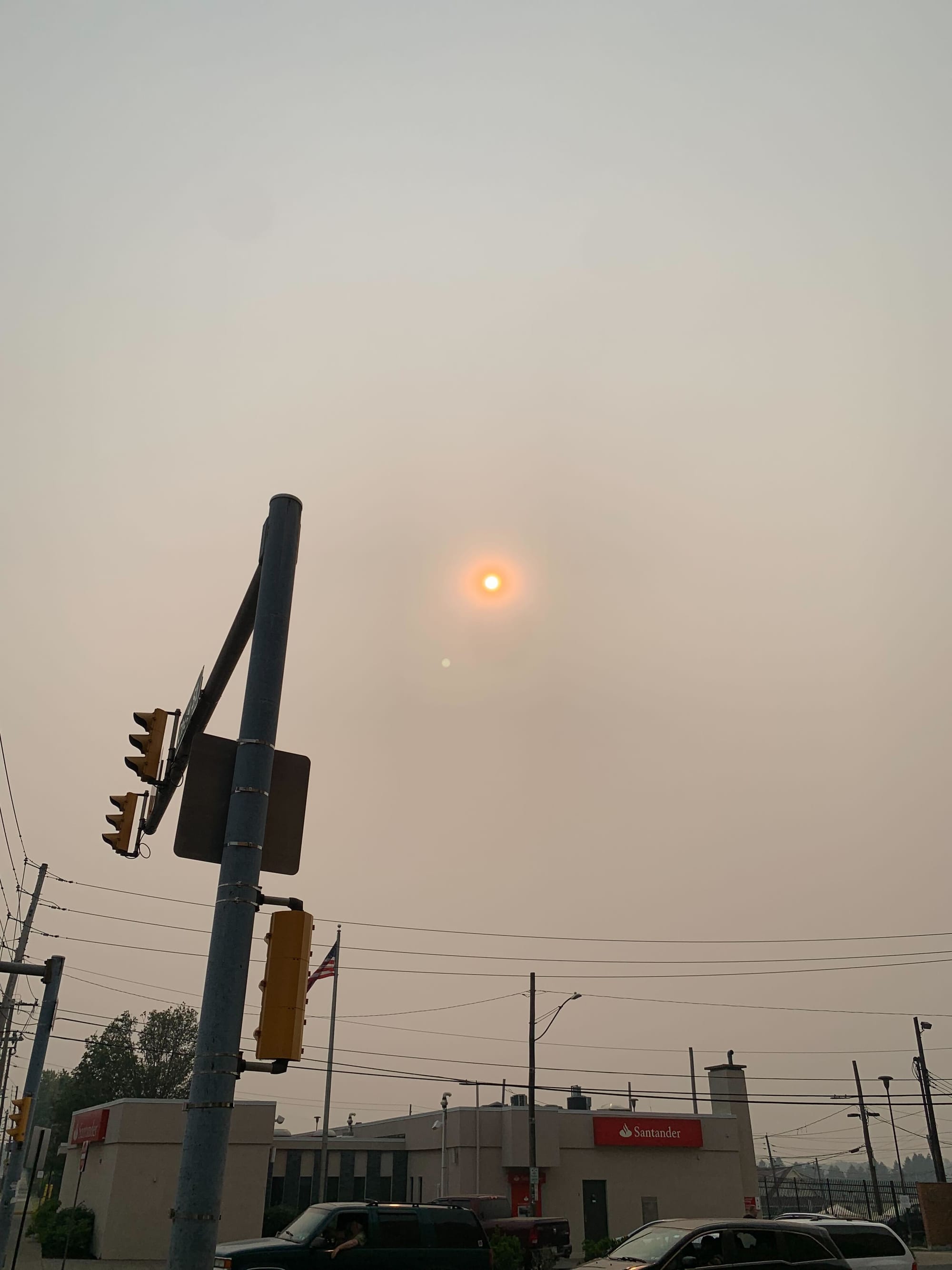 The sun beats down, through the smoke, at 17th and Chew Streets in Allentown.