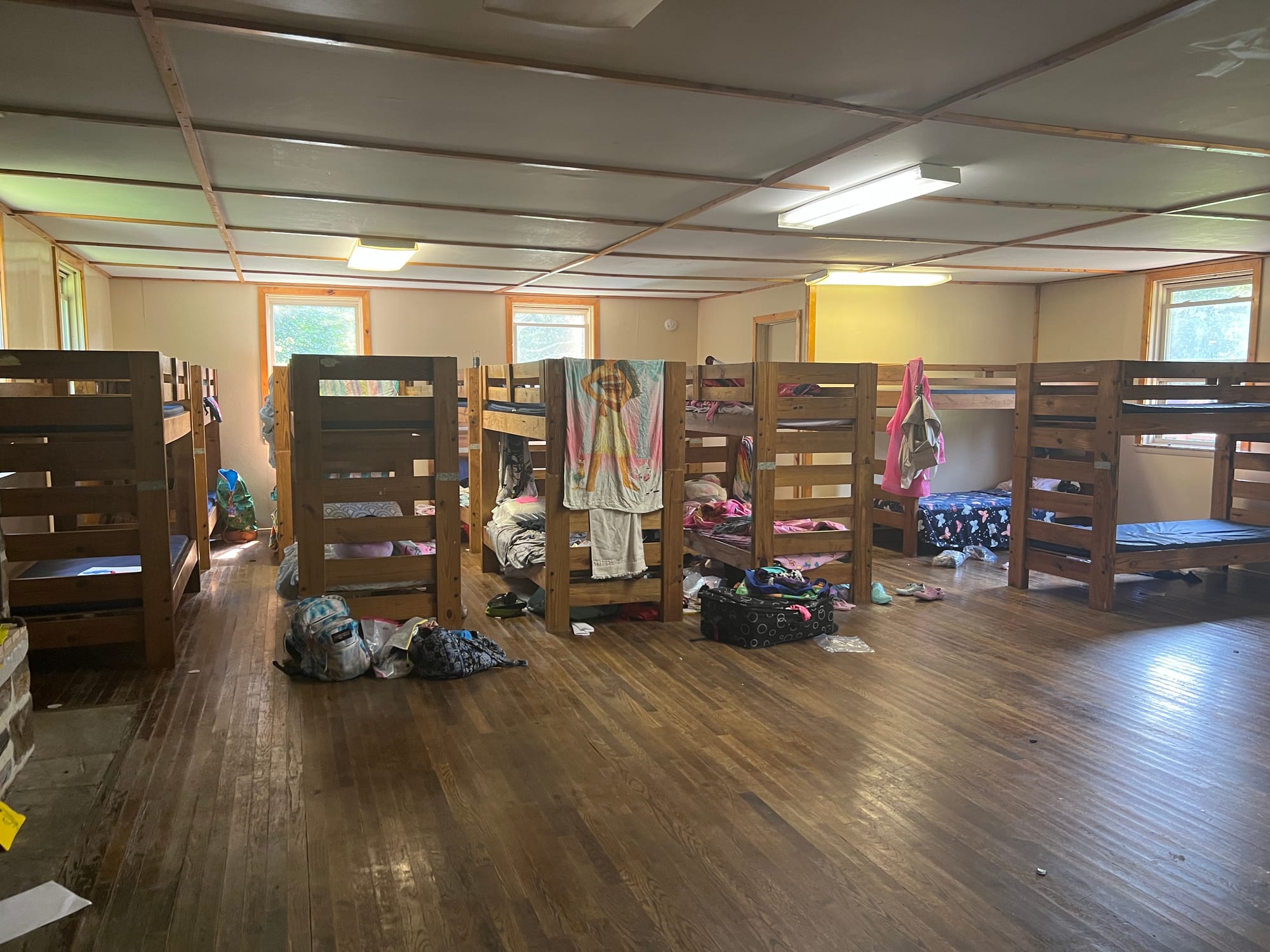 Cabins sleep up to 26 girls, with a small bunk room that fits two staff, a kitchen and bathroom. Camp Director Smilez says th