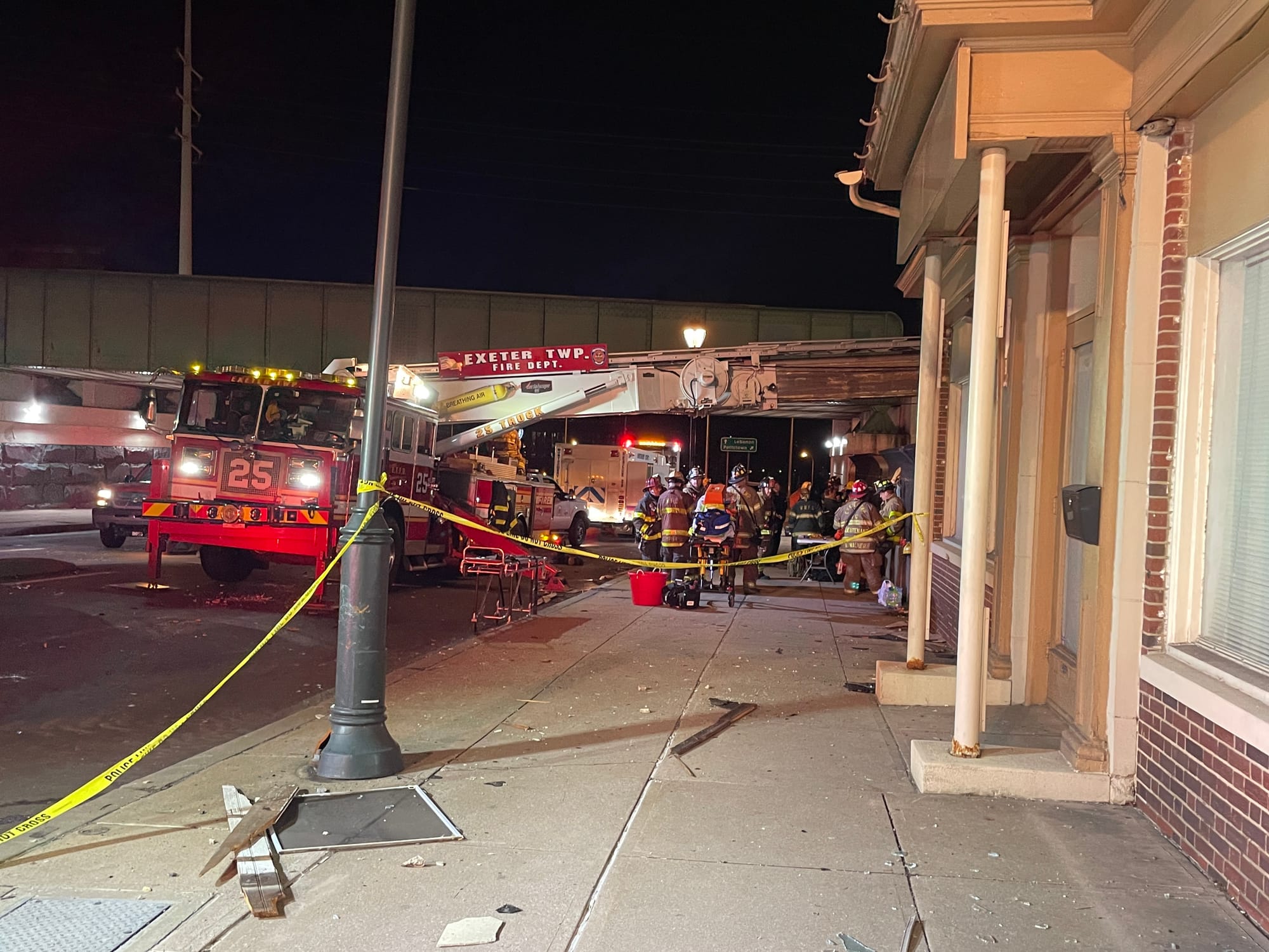 Emergency crews worked in the wreckage surrounding the area of the explosion.