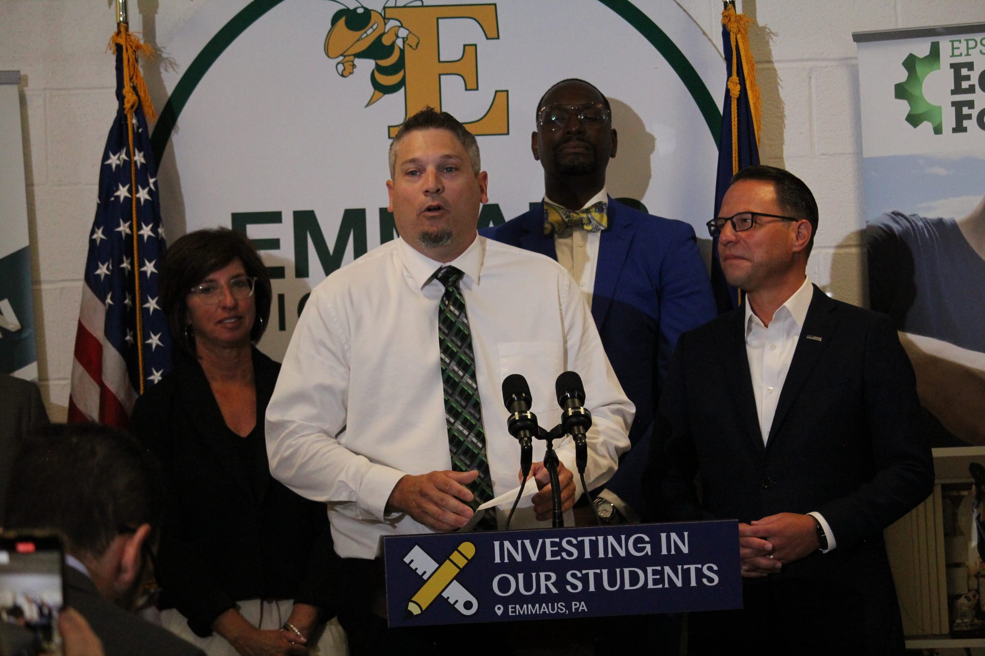 Emmaus High School Social Studies Teacher Eric Luckenbill delivers remarks with Governor Josh Shapiro Thursday.