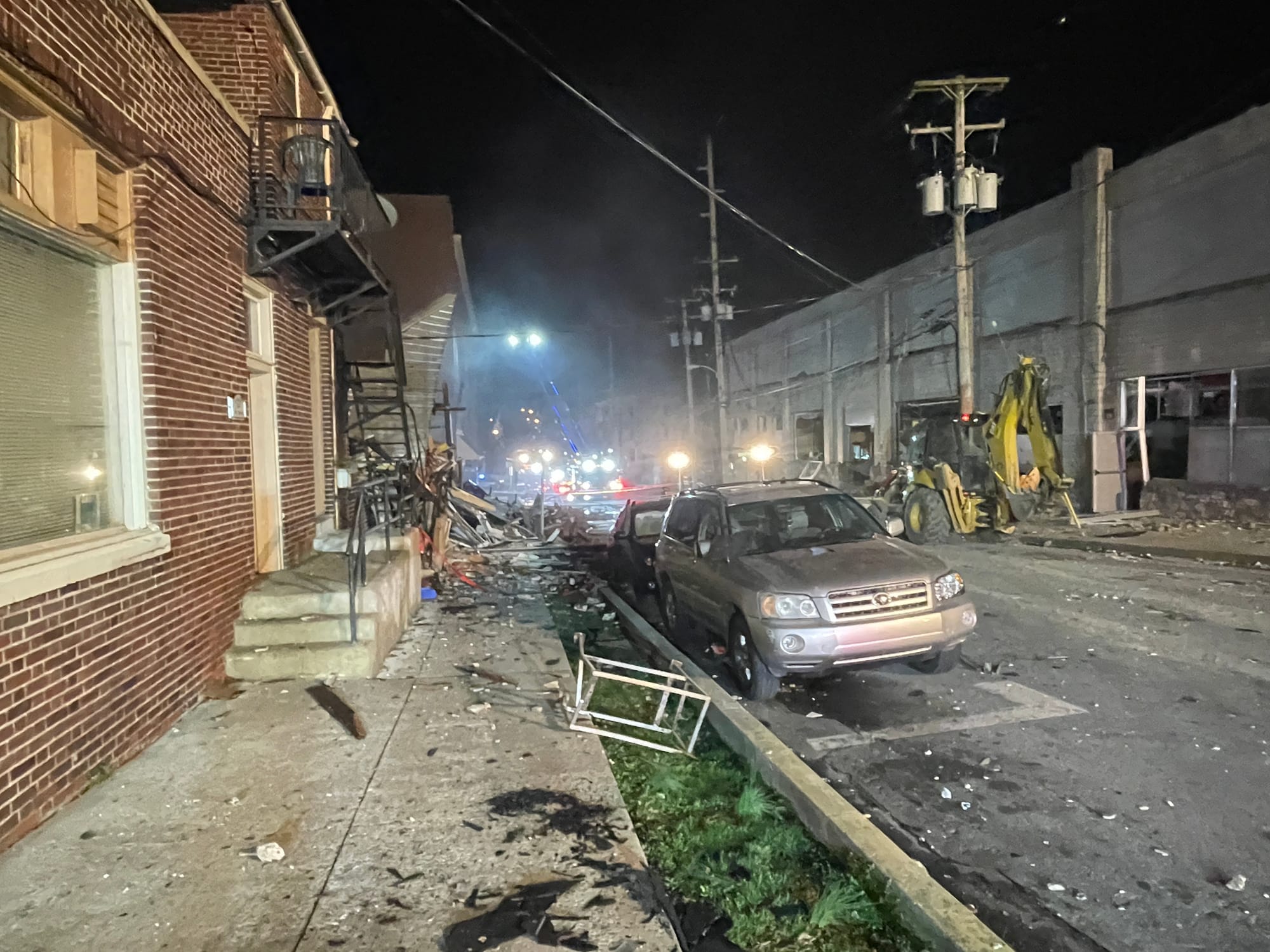 Emergency crews worked in the wreckage surrounding the area of the explosion.